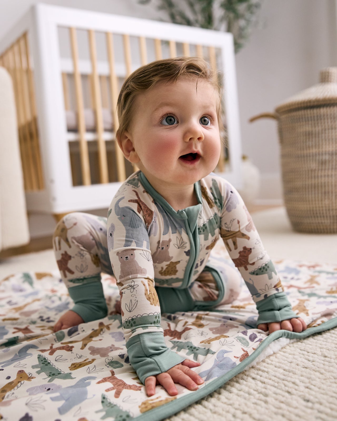 Baby sitting on the Sweet Safari Mini Cloud Blanket