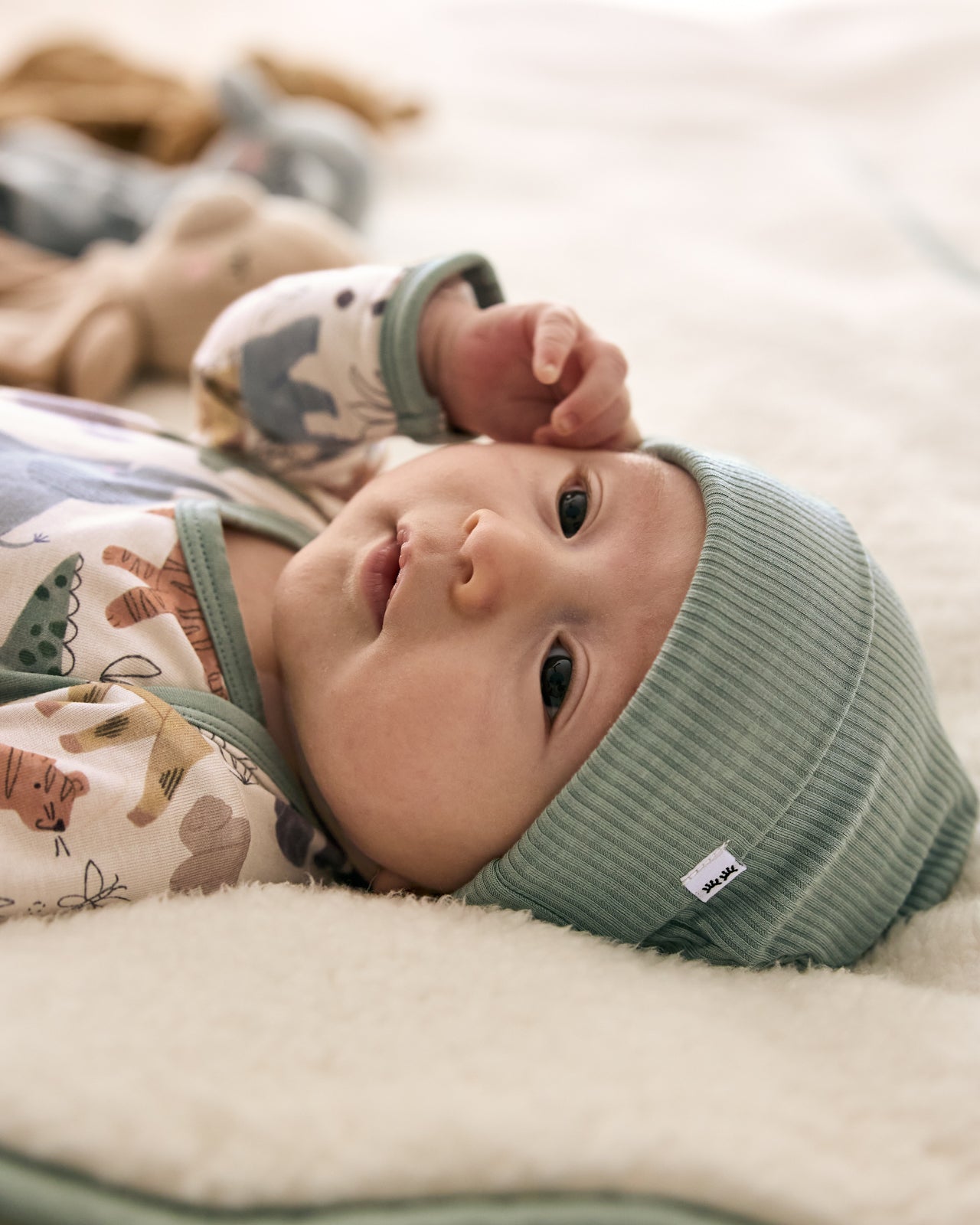 Baby wearing the Willow Ribbed Infant Beanie with a safari themed outfit