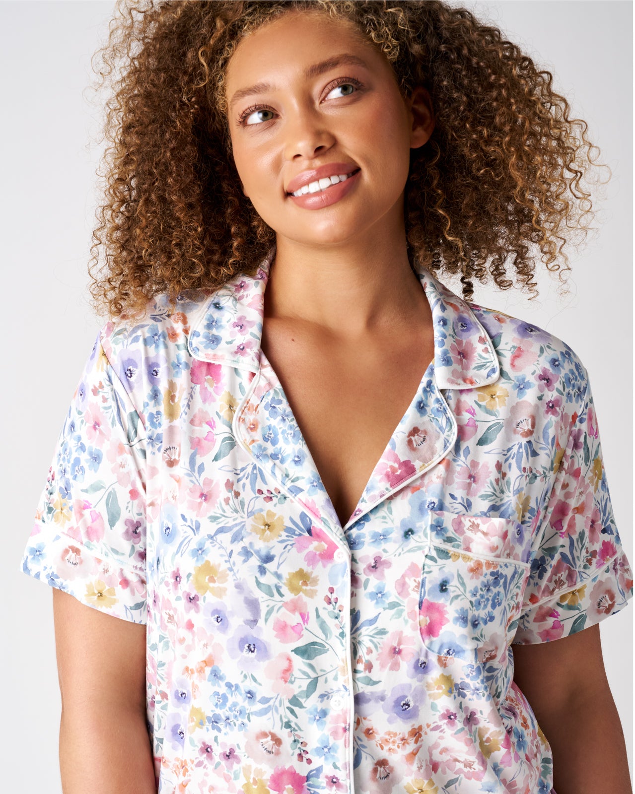Close up of woman wearing the Tiny Blooms Women's Short Sleeve PJ top