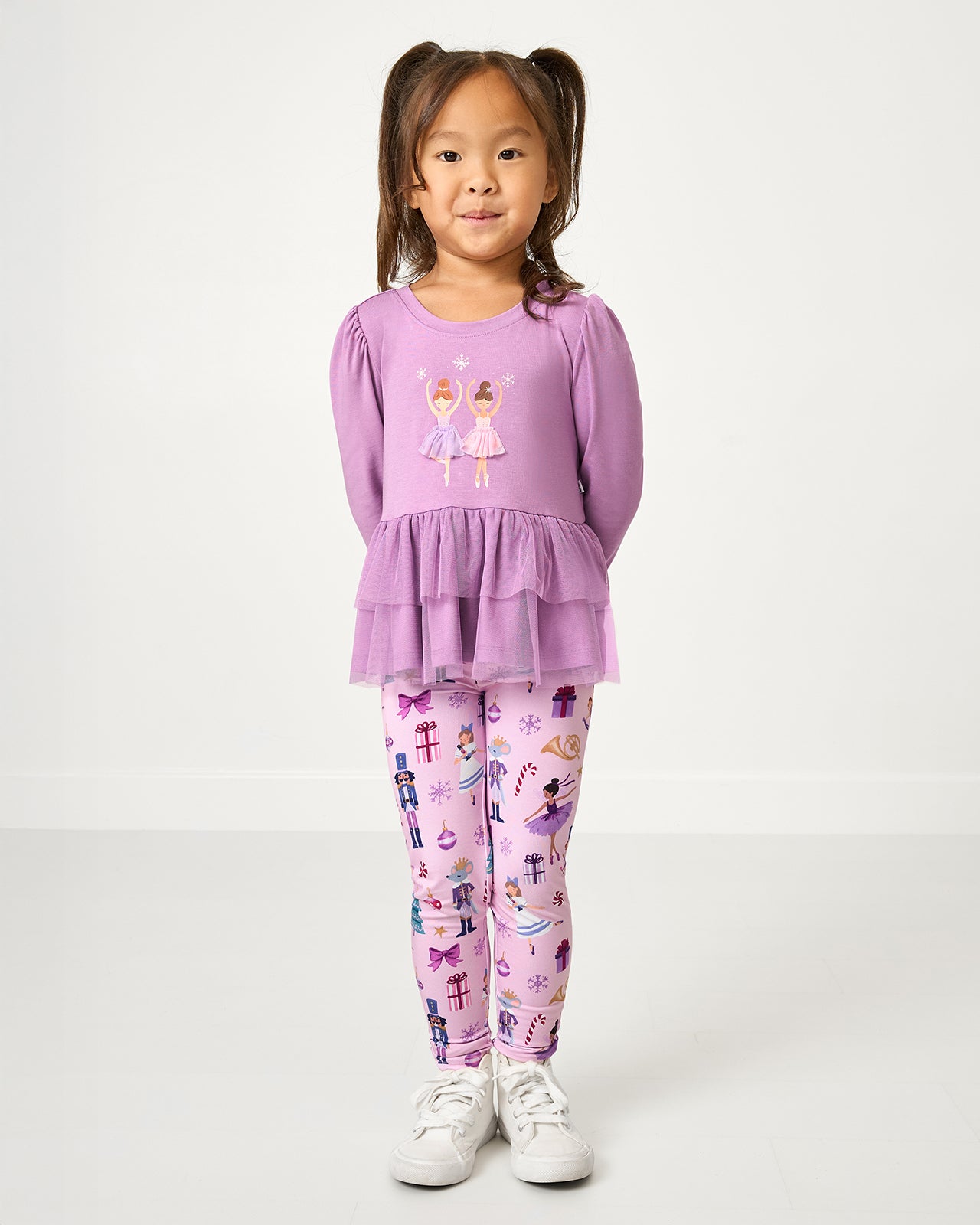 Girl wearing the Nutcracker Ballet Legging with a Ballerina themed top