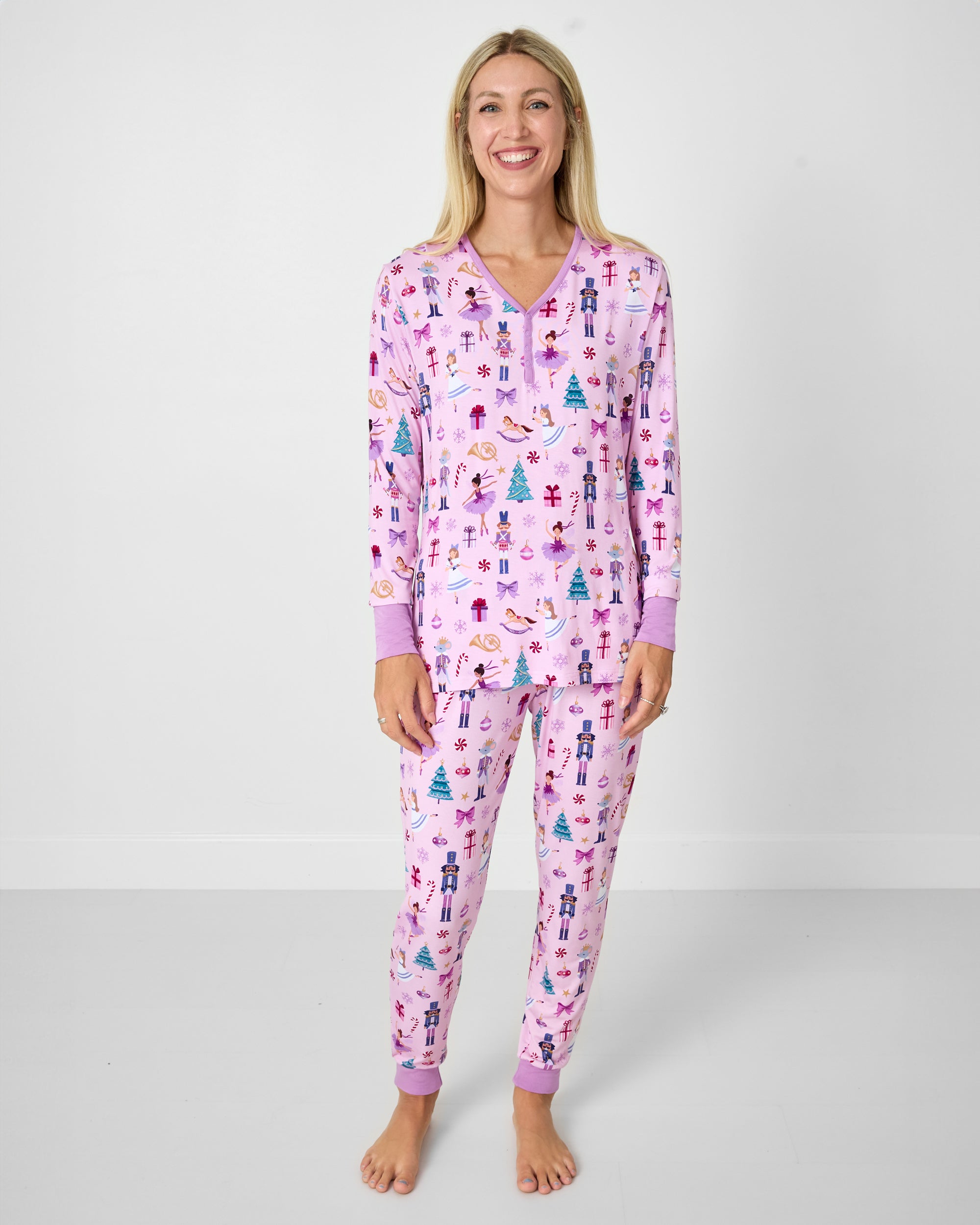 Woman wearing the Nutcracker Ballet Women's Pajama Pants with a matching pajama top