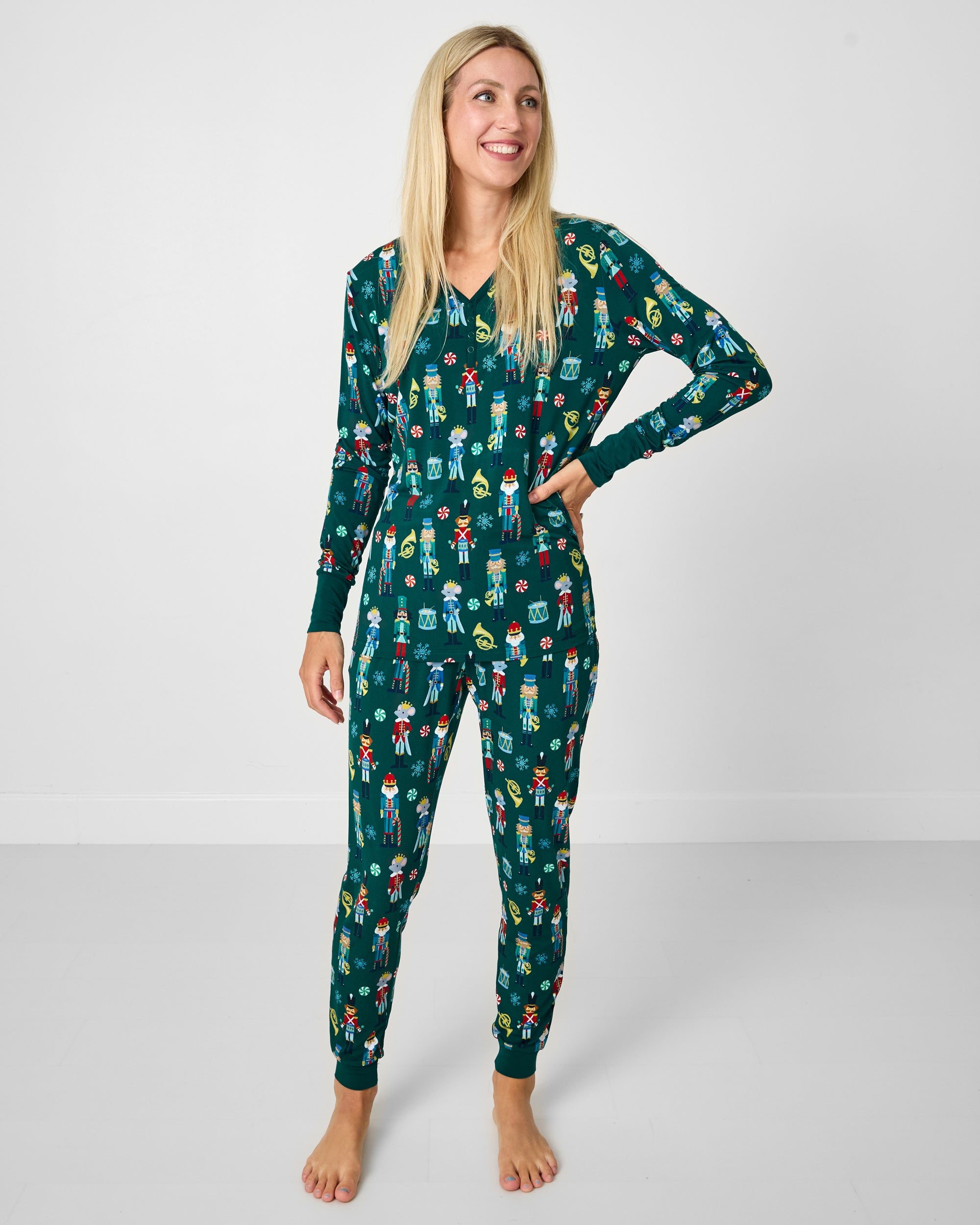 Woman wearing the Nutcracker March Women's Pajama Pants with a matching pajama top