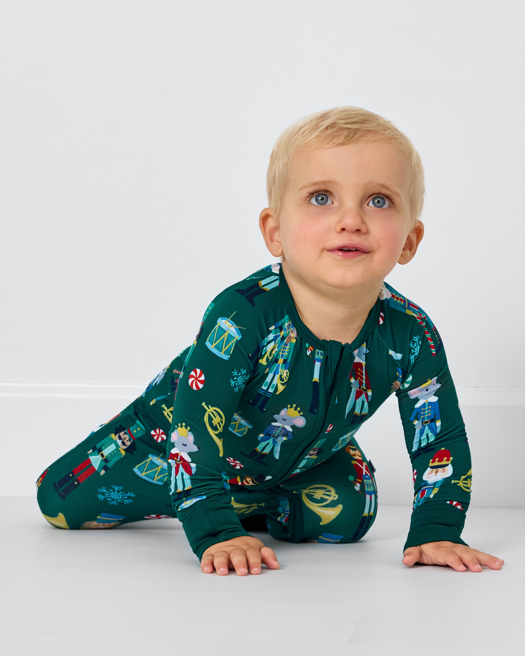 Crawling baby wearing the Nutcracker March Zippy