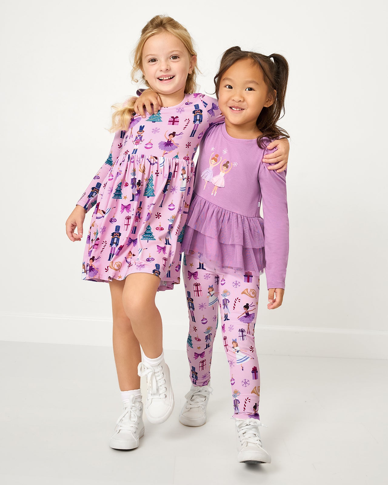 Two girls wearing matching Nutcracker Ballet styles