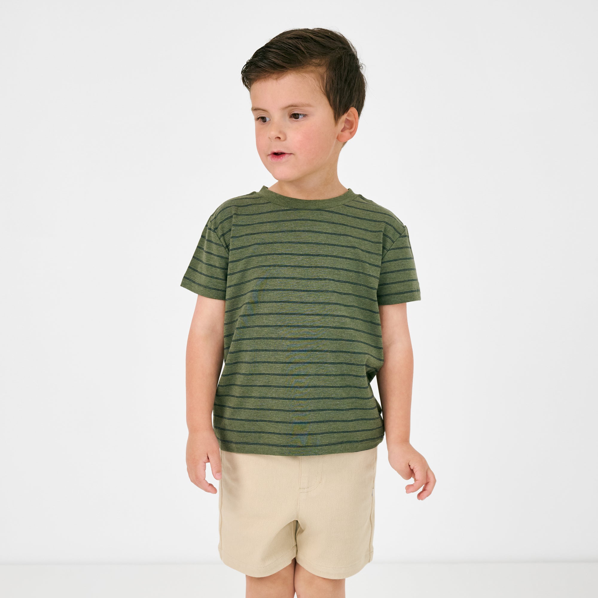 Standing child wearing the Olive Stripes Short Sleeve Relaxed Tee