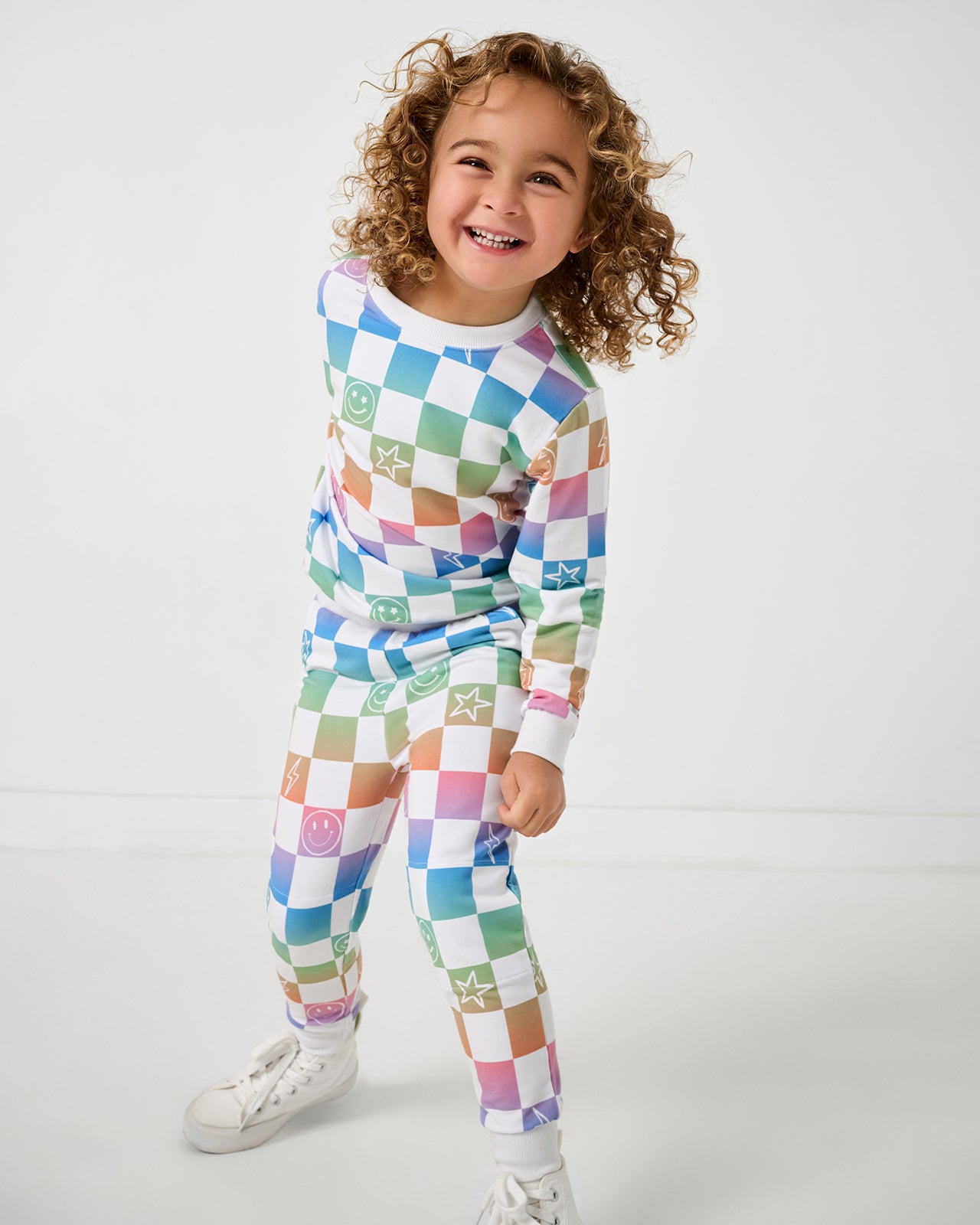 Girl wearing the Ombre Cheery Checks Jogger and matching sweatshirt