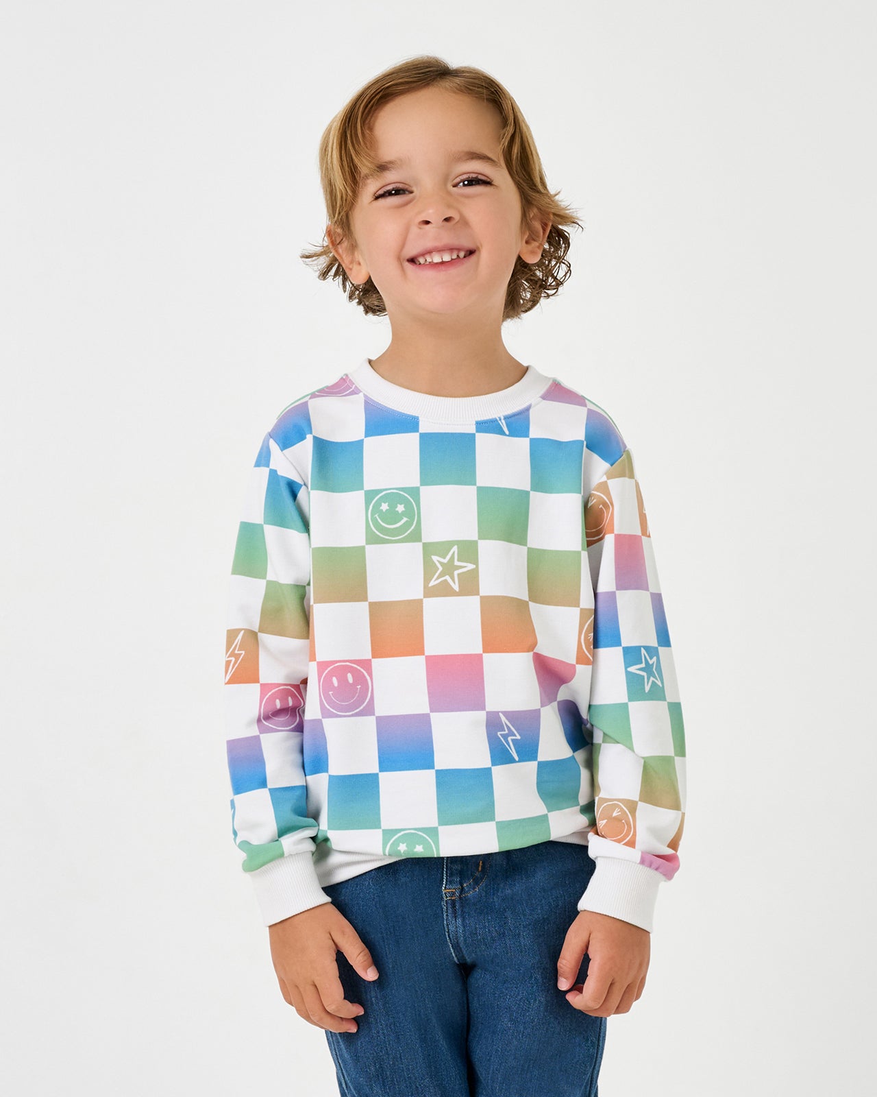 Boy wearing the Ombre Cheery Checks Crewneck Sweatshirt with denim joggers