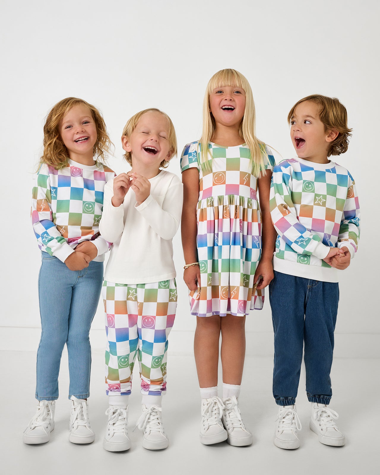 Group of four children wearing matching Ombre Cheery Checks play styles