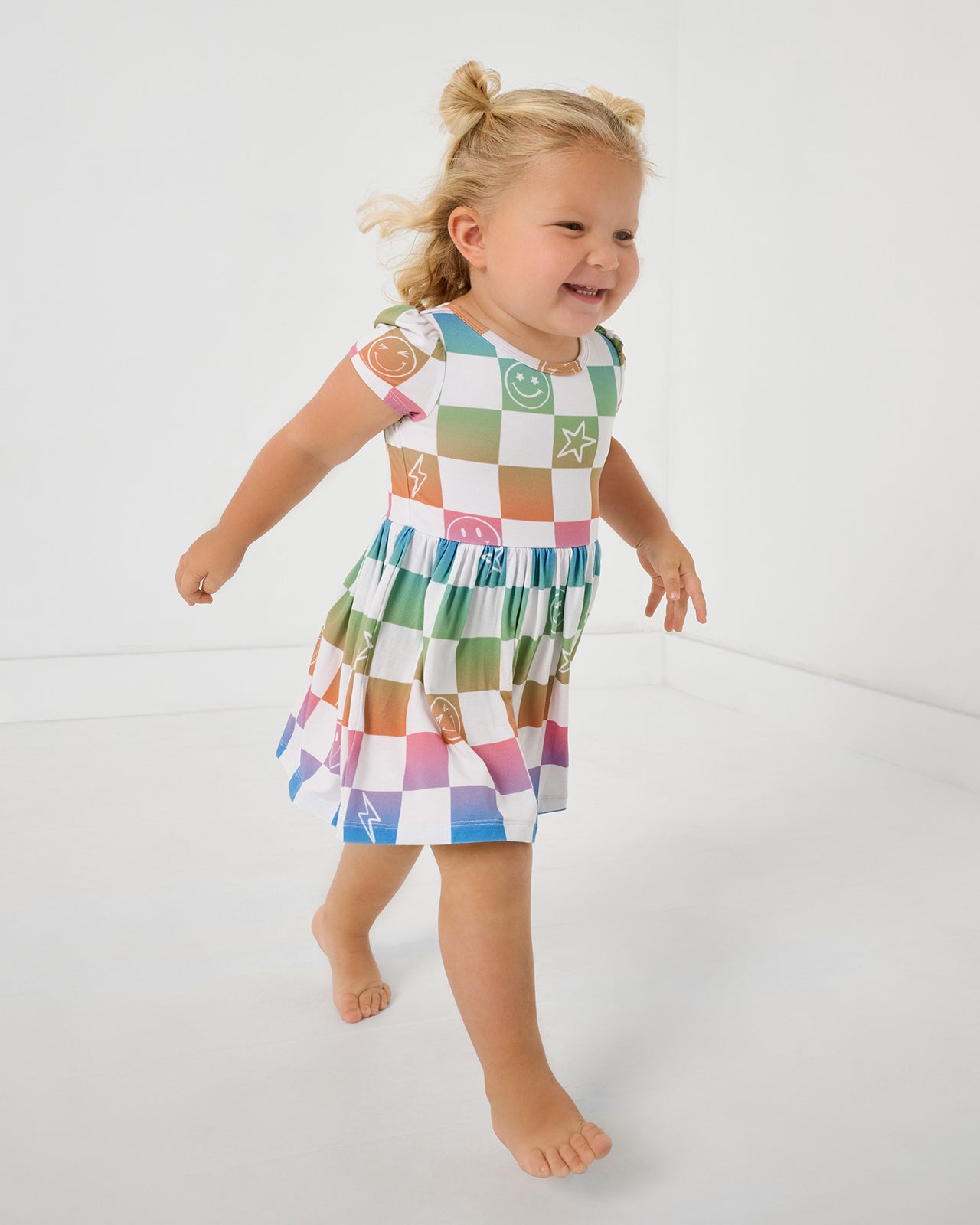 Walking child wearing the Ombre Cheery Checks Skater Dress with Bodysuit