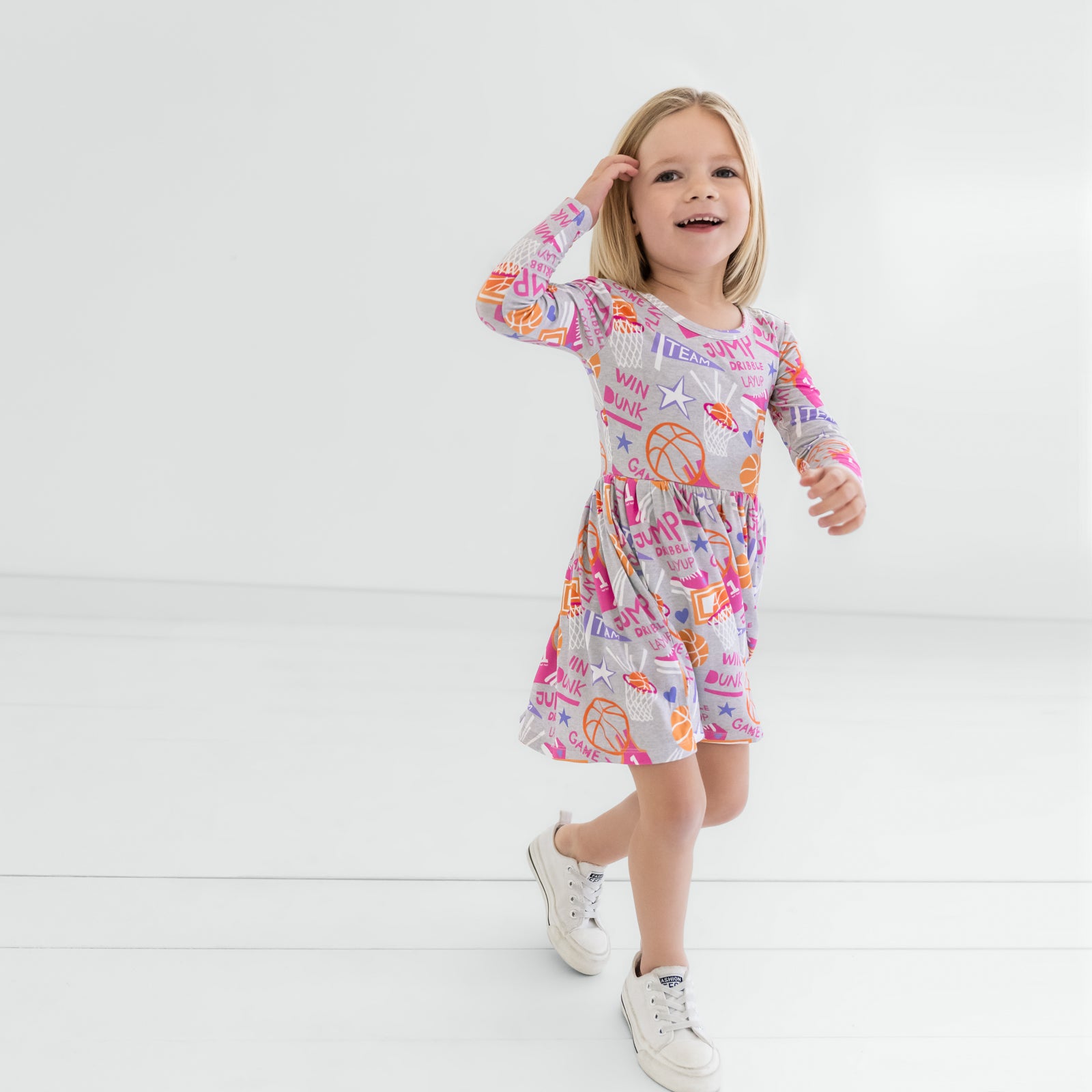 Child walking in the Pink Slam Dunk Skater Dress