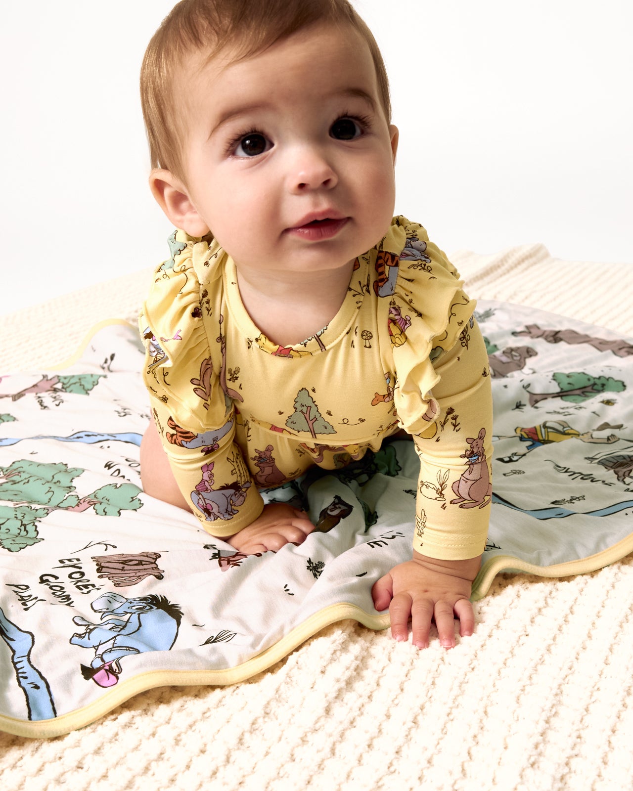 Baby crawling on the Disney Hundred Acre Wood Mini Cloud Blanket®