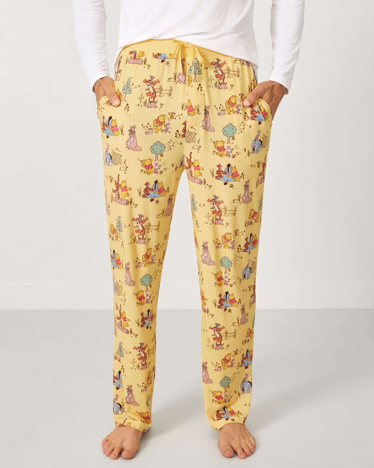 Man wearing the Disney Playtime With Pooh Men's Pajama Pants