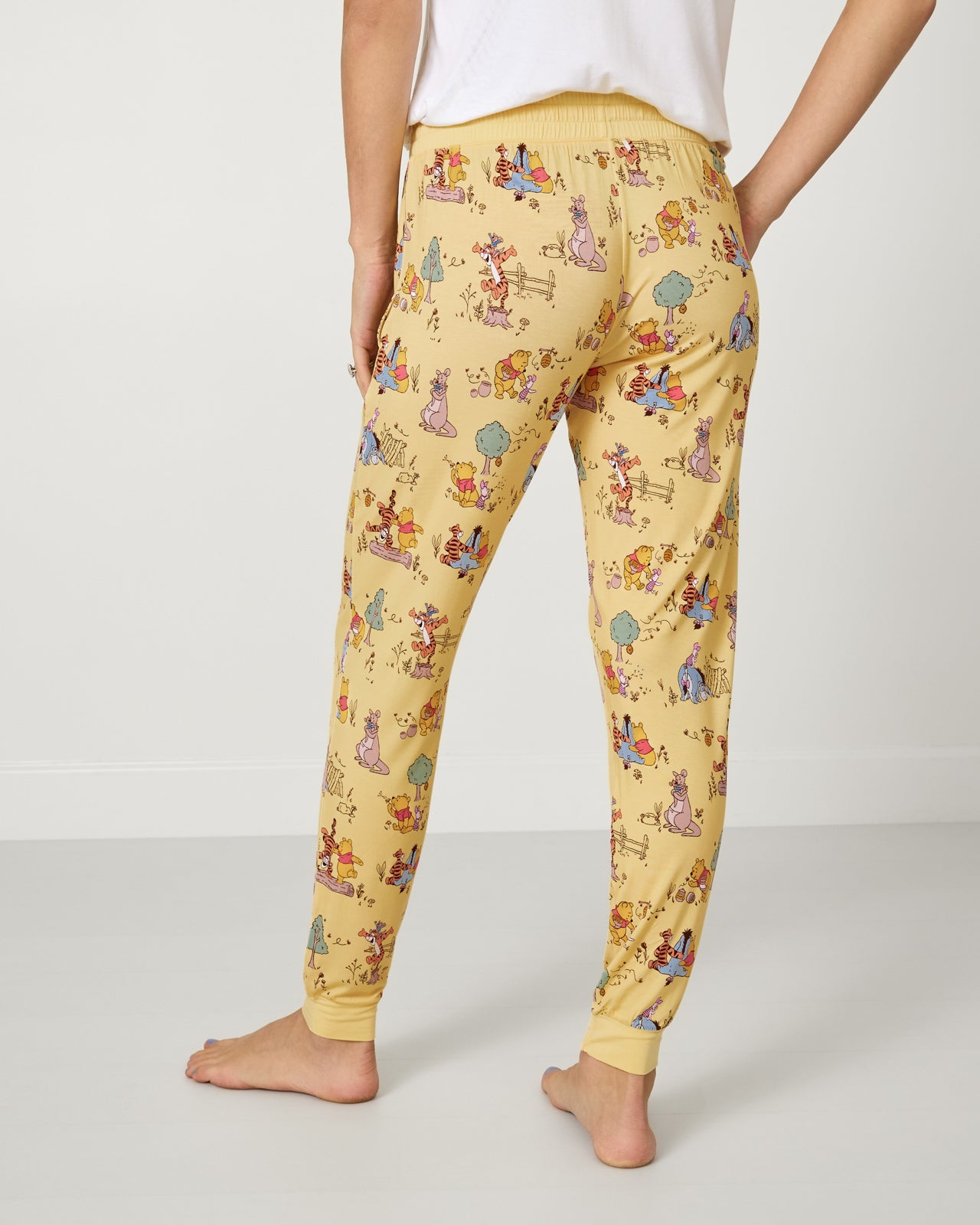 Back view of woman wearing the Disney Playtime With Pooh Women's Pajama Pants