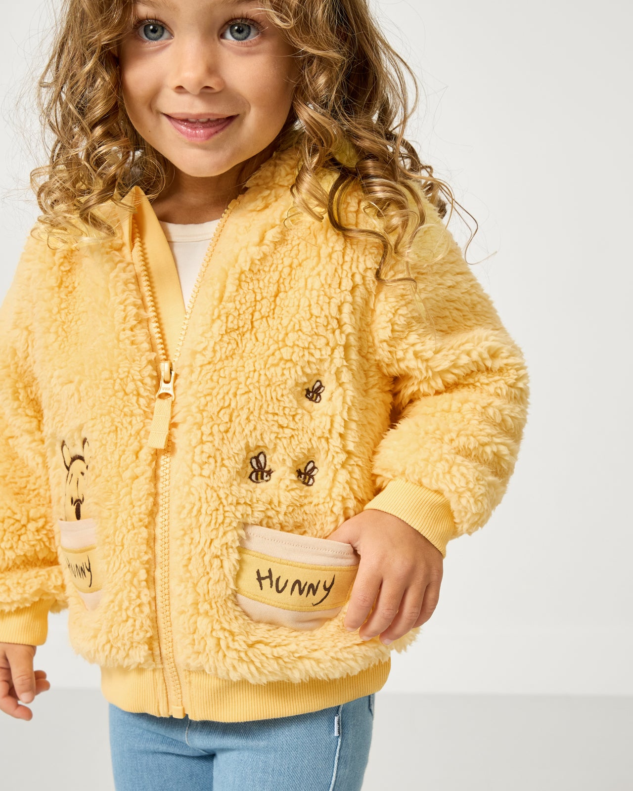 Girl wearing the Disney Winnie the Pooh Sherpa Zip Hoodie