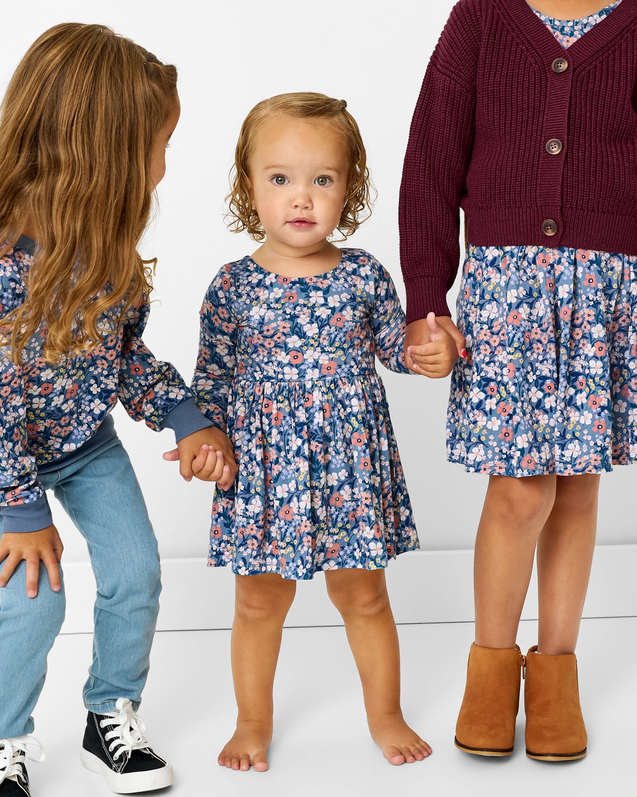 Group of three girls wearing matching Petite Petals play styles
