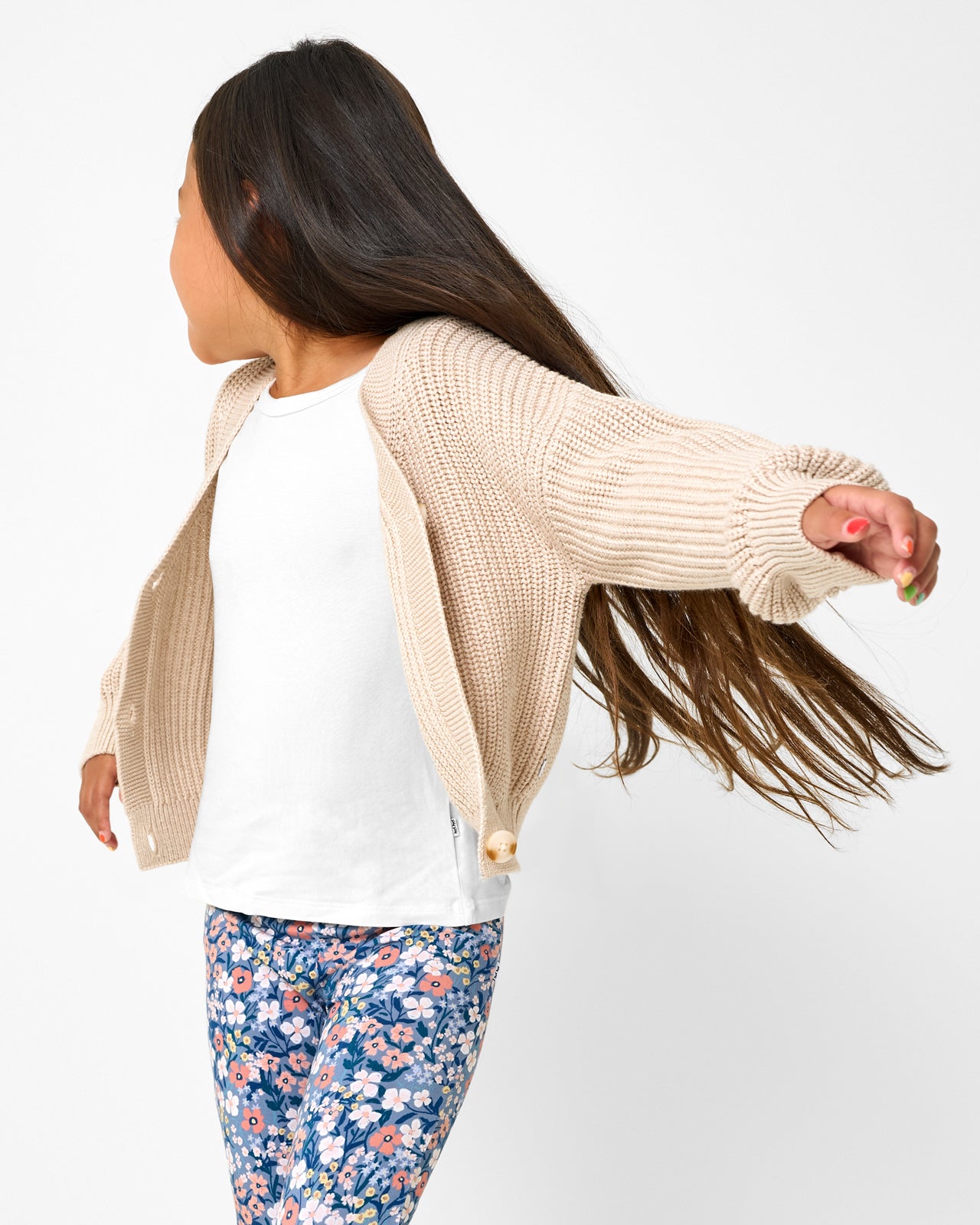 Child in motion wearing the Natural Heather Cropped Sweater