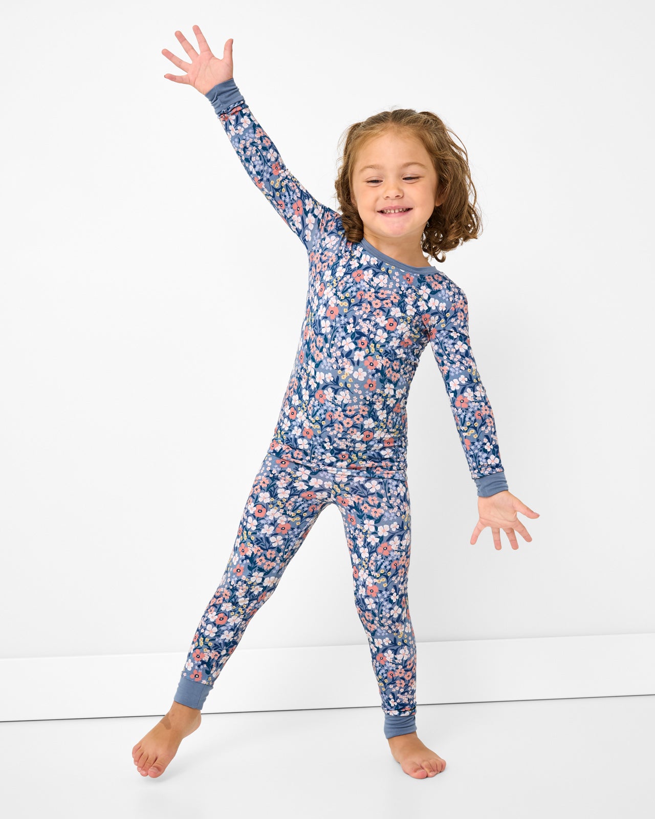 Posing girl wearing the Petite Petals Two-Piece Pajama Set