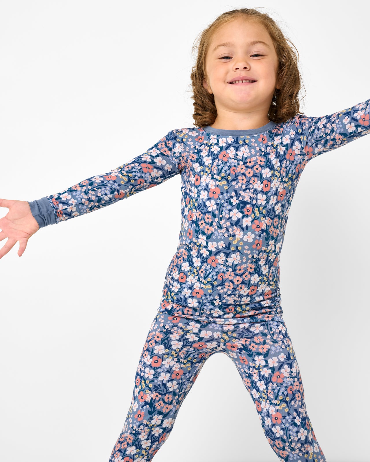 Close up of girl wearing the Petite Petals Two-Piece Pajama Set