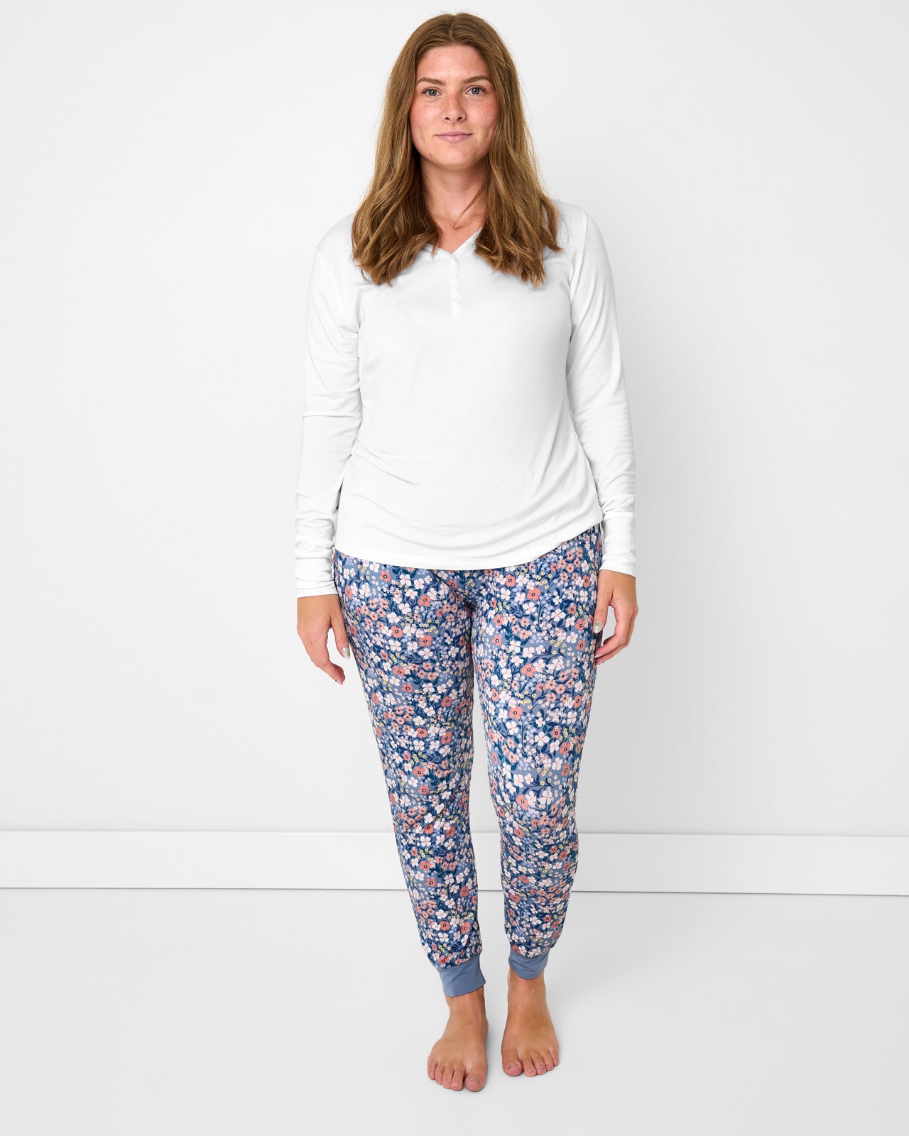 Woman wearing the Petite Petals Women's Pajama Pants with a white pajama top