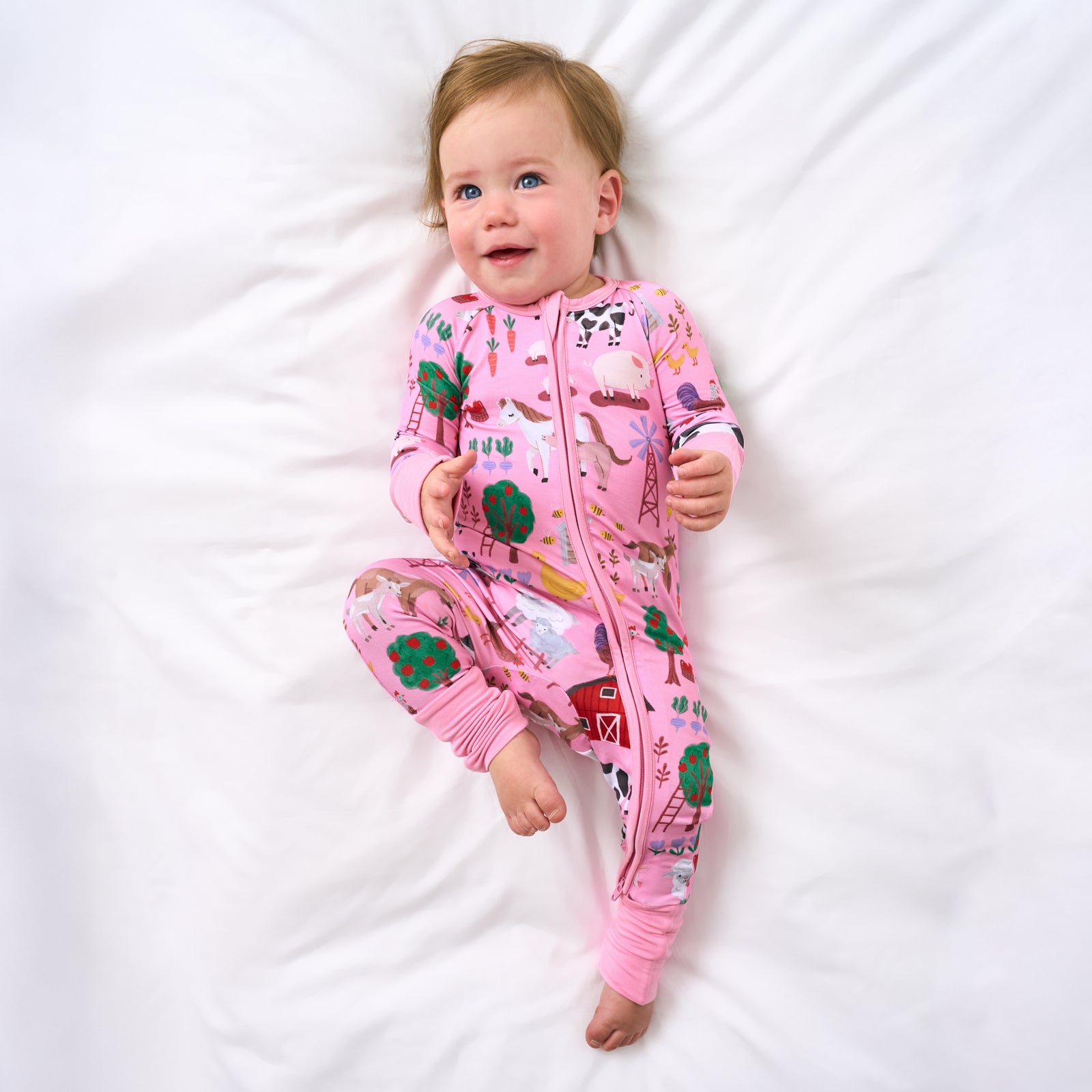 Aerial view of child wearing the Pink Farm Fam Zippy