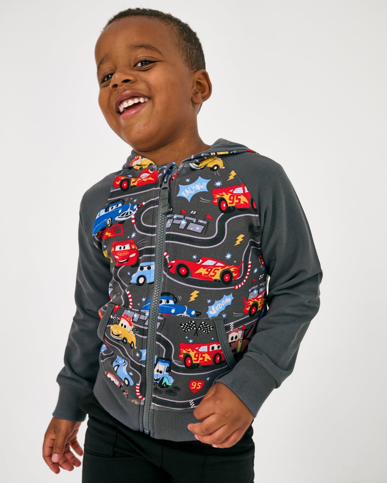 Boy wearing the Disney & Pixar Piston Cup Zip Hoodie