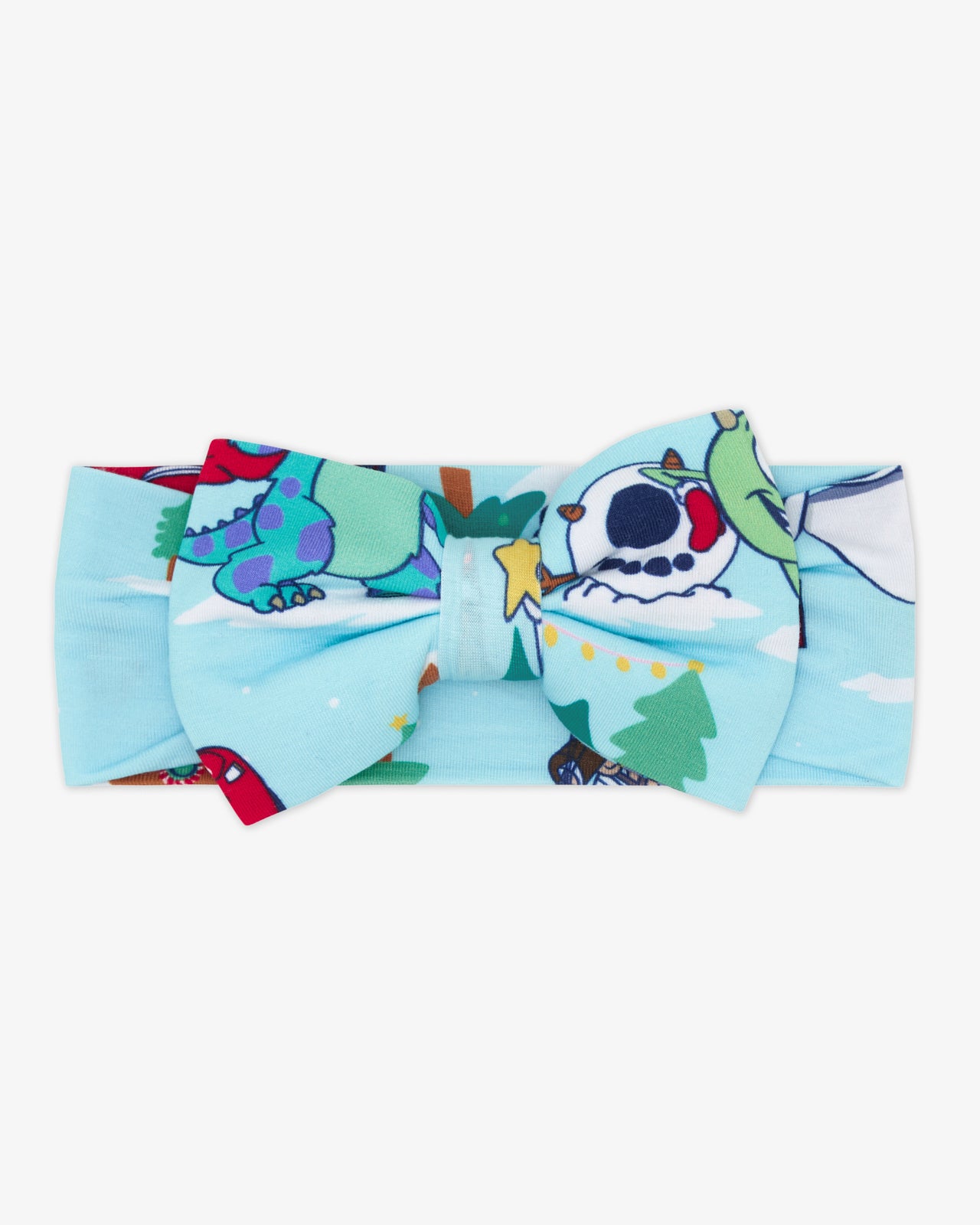 Flat lay of the Disney & Pixar Christmas Village Luxe Bow Headband