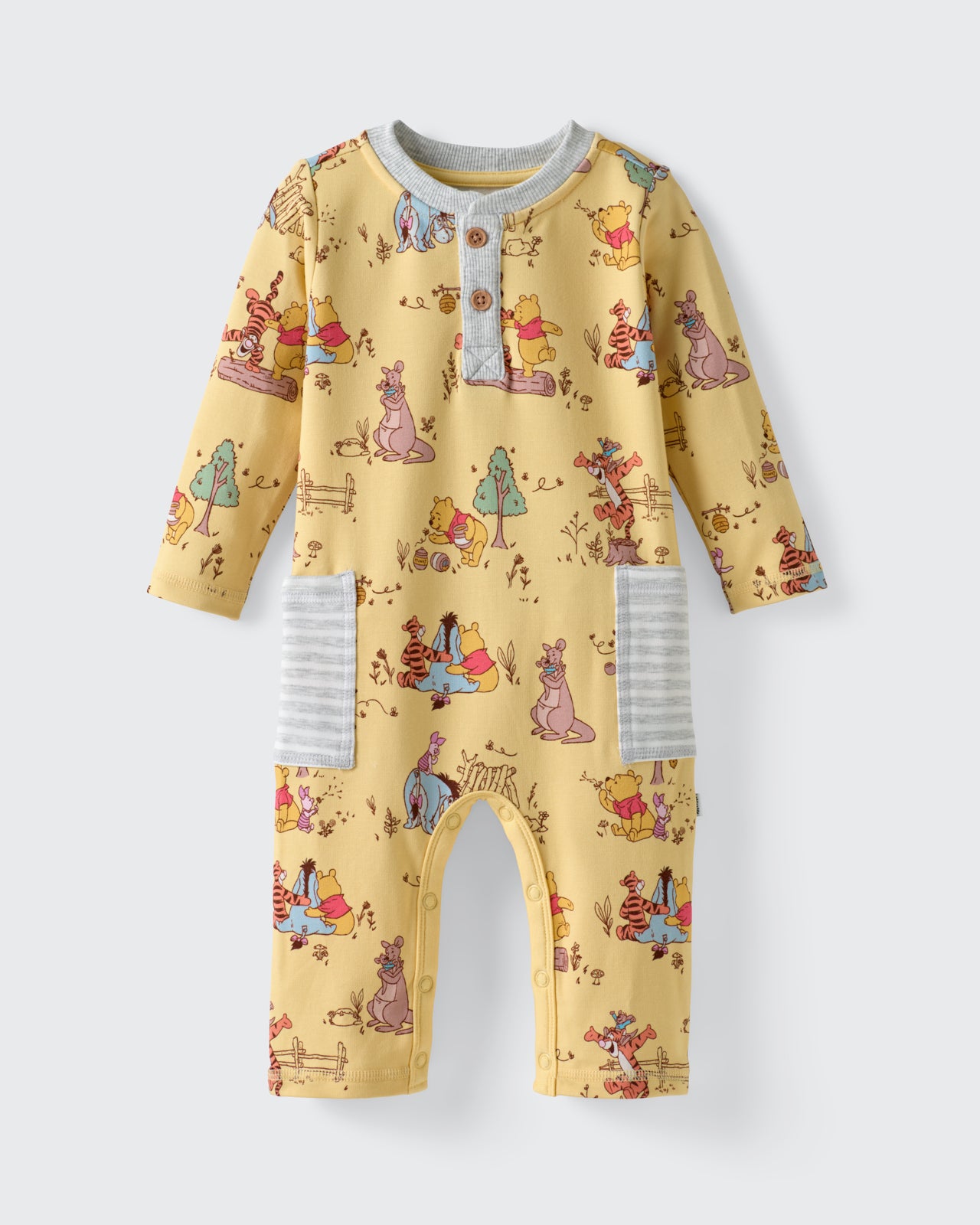 Flat lay of the Disney Playtime With Pooh Henley Romper