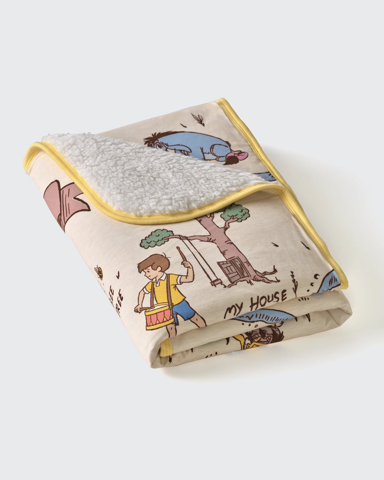 Flat lay of the folded Disney Hundred Acre Wood Mini Cloud Blanket®