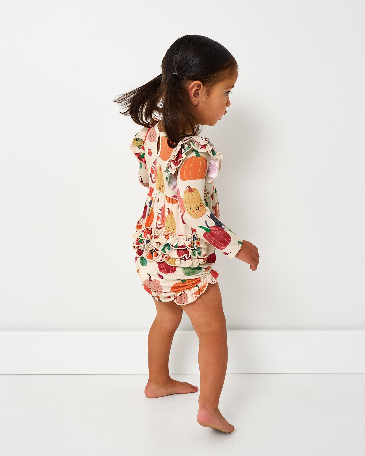 Back view of toddler wearing the Pumpkin Pals Bubble Romper