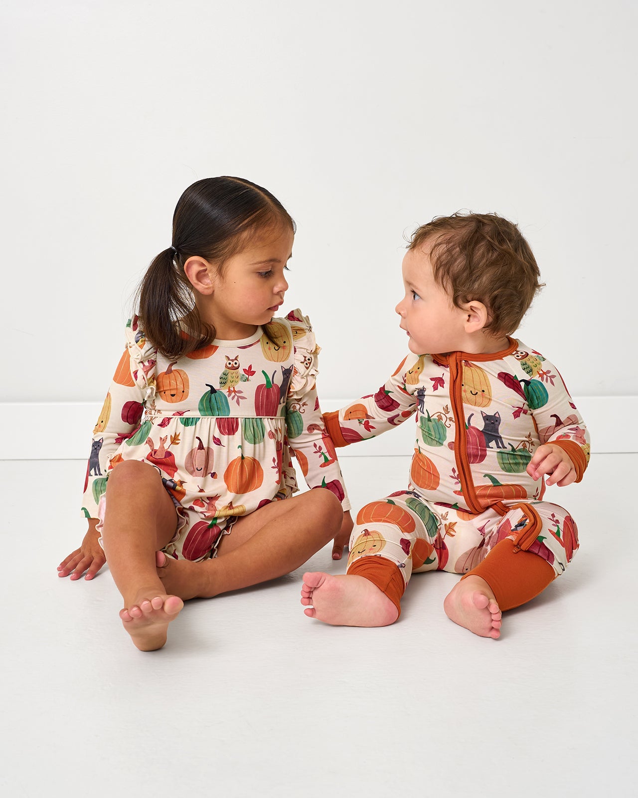 Two children wearing matching Pumpkin Pals styles