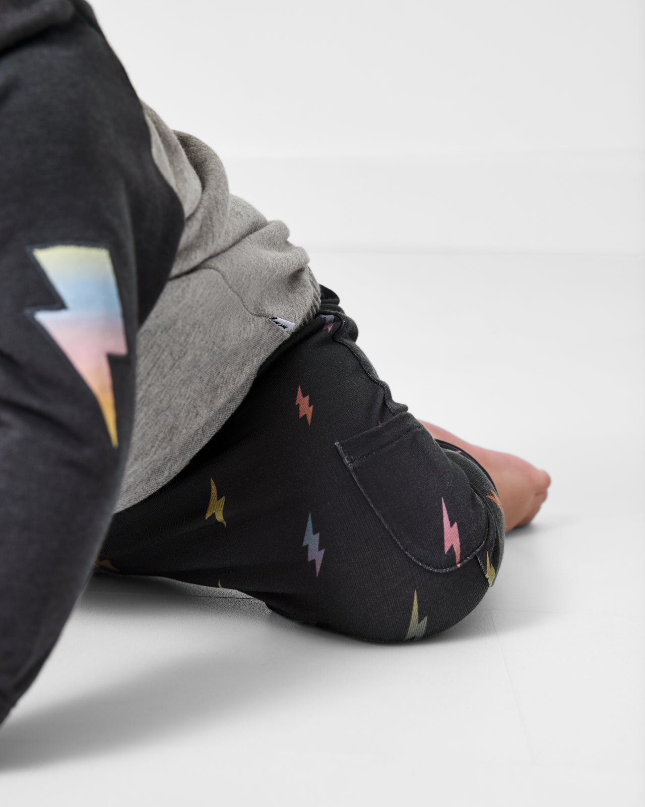 Close up of crawling child wearing the Rad Bolts Cinched Jogger