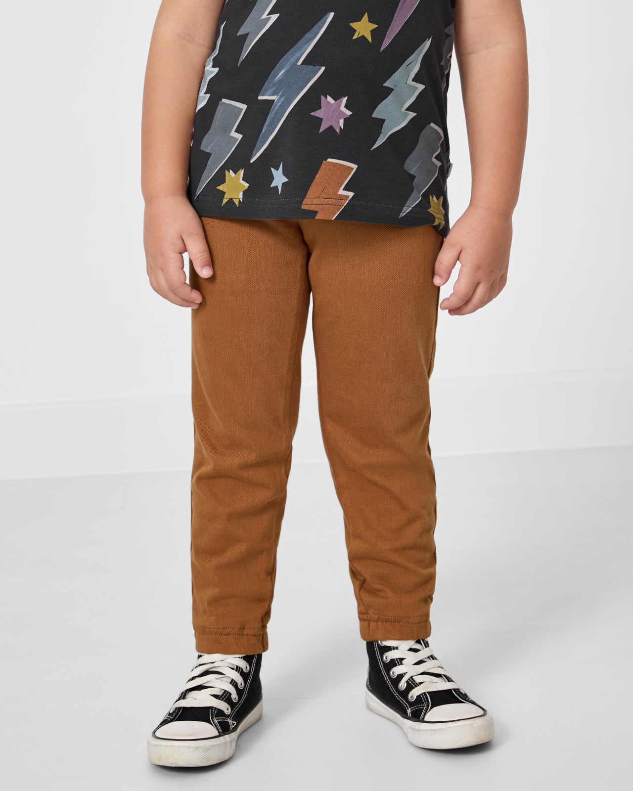 Front view of boy wearing the Rich Toffee Denim Jogger