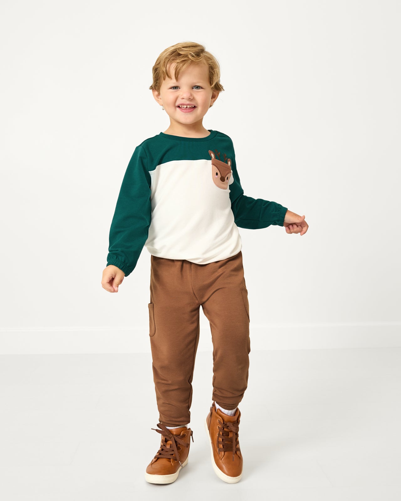 Boy wearing the Caramel Cinched Jogger with a Reindeer Crewneck