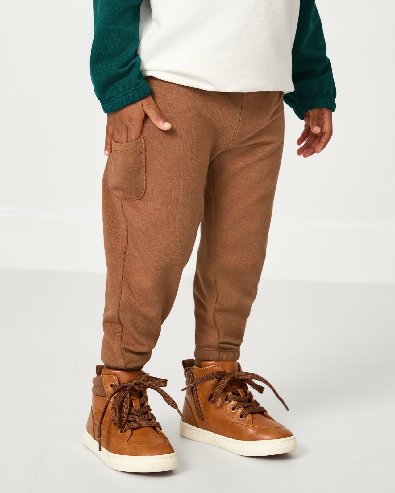 Child wearing the Caramel Cinched Jogger with sneakers