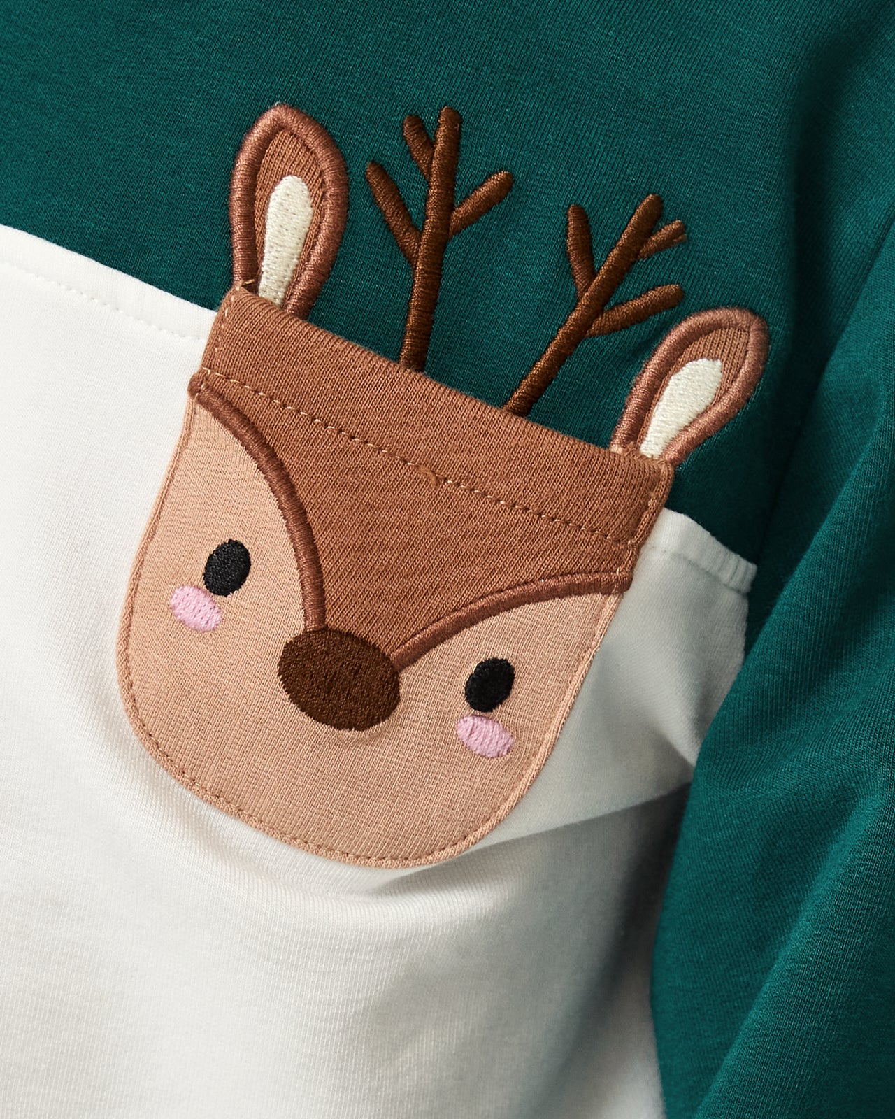 Close up of the reindeer pocket on the Reindeer Cinched Pocket Sweatshirt