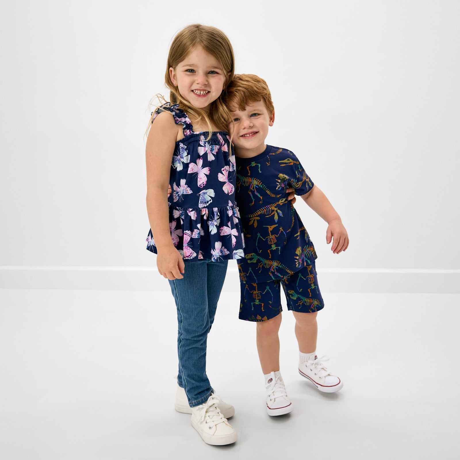 Two children wearing styles from the Back To School collection