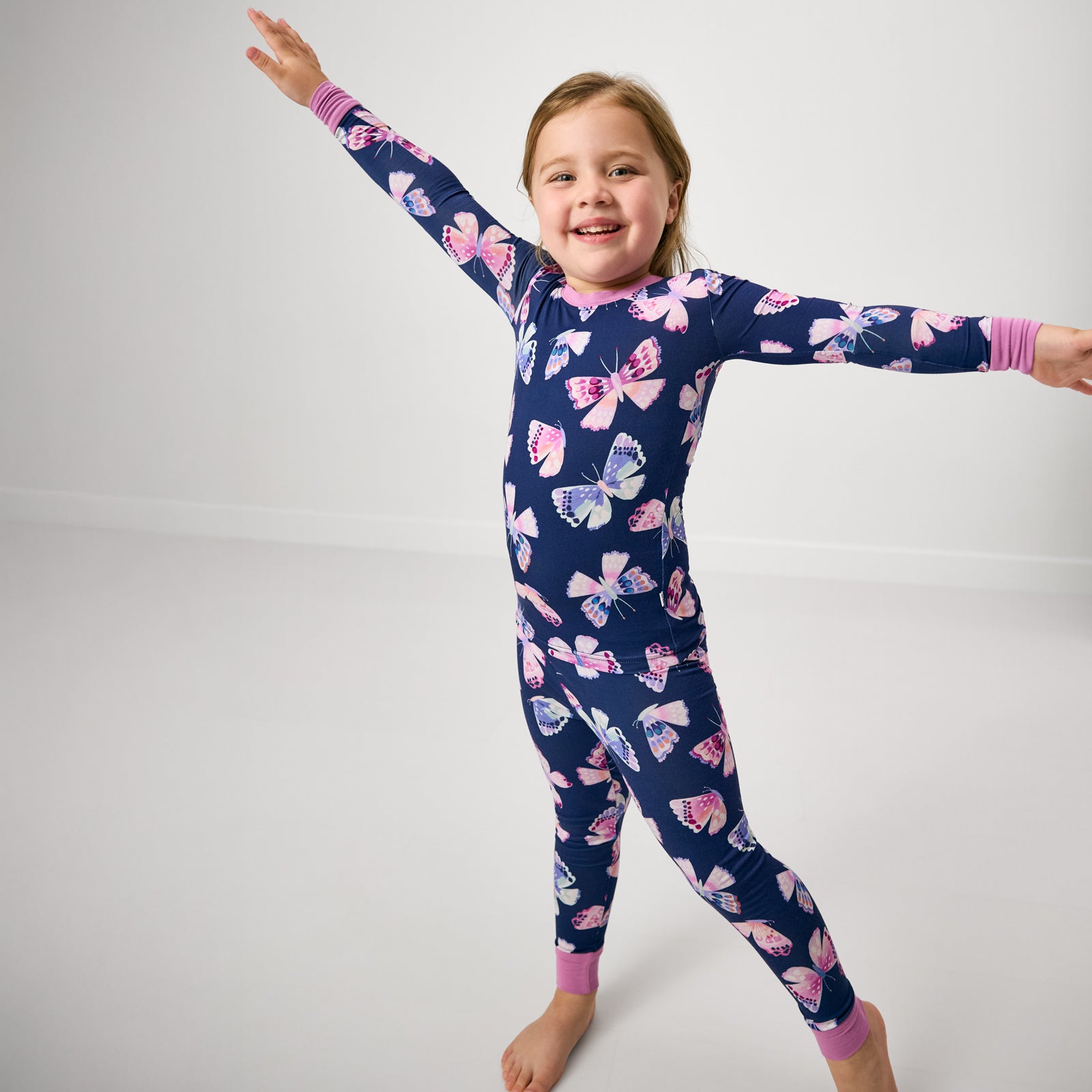 Posing girl wearing the Royal Butterflies Two-Piece Pajama Set