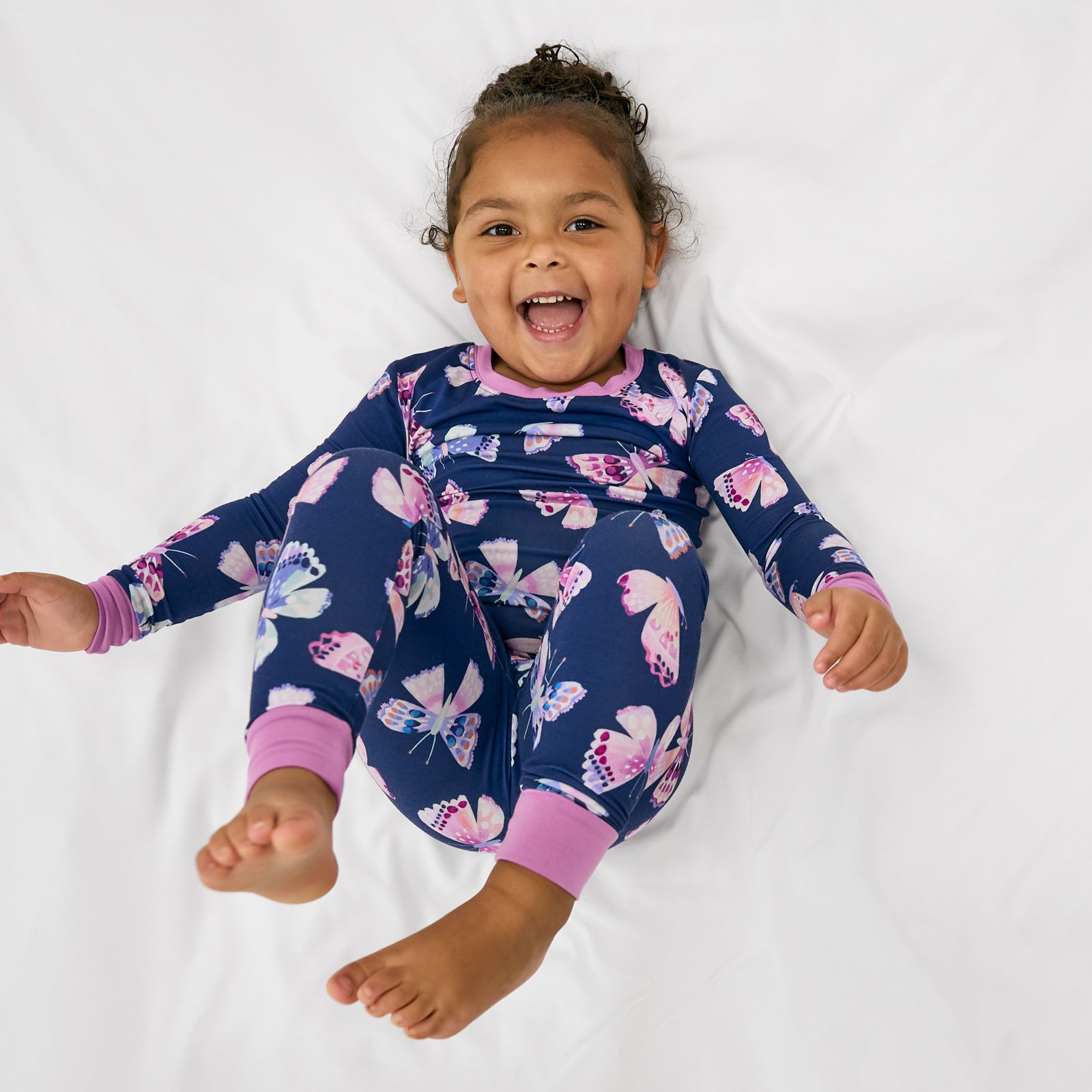 Aerial view of girl wearing the Royal Butterflies Two-Piece Pajama Set