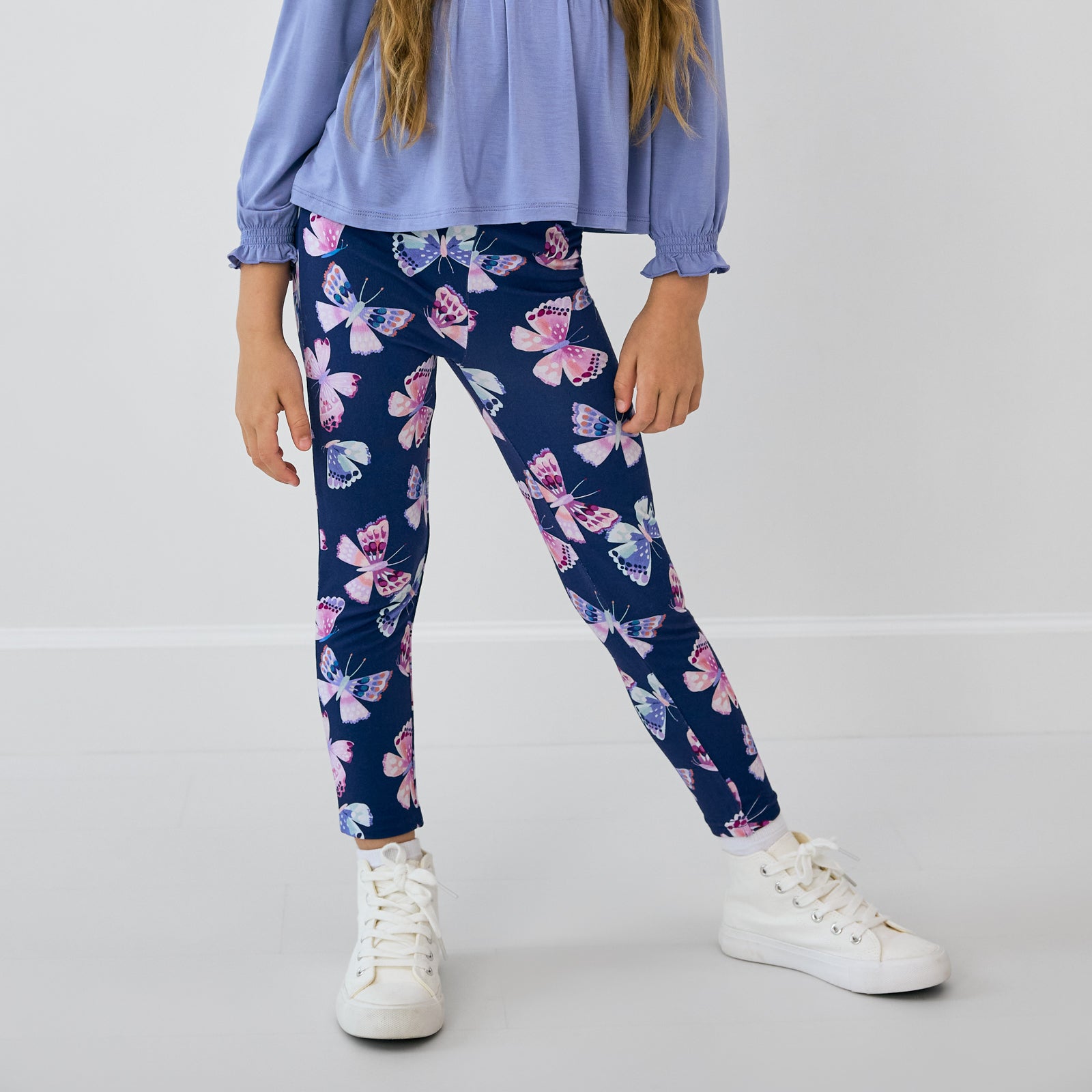 Close up of child wearing the Royal Butterflies Legging