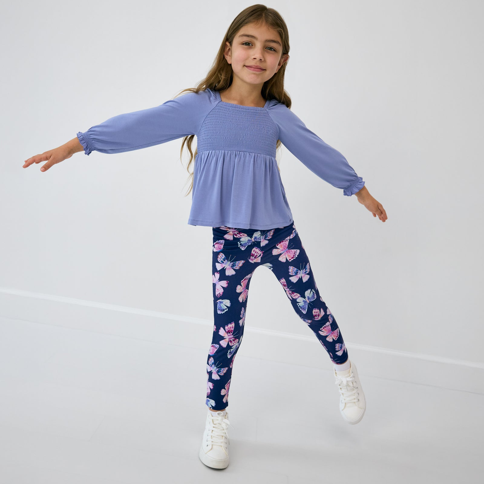 Posing child wearing the Royal Butterflies Legging