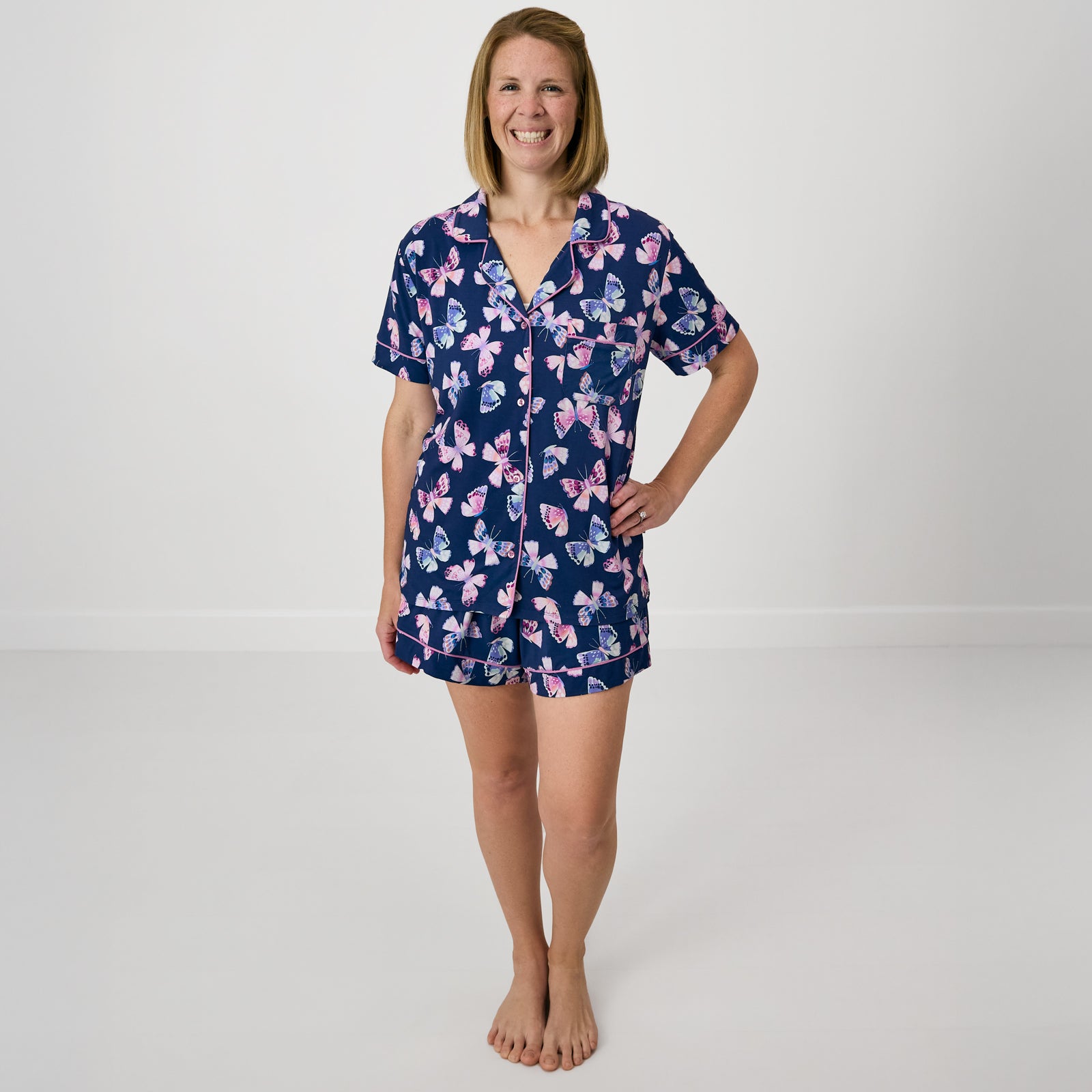 Standing woman wearing the Royal Butterflies Bamboo Women's Pajama Set