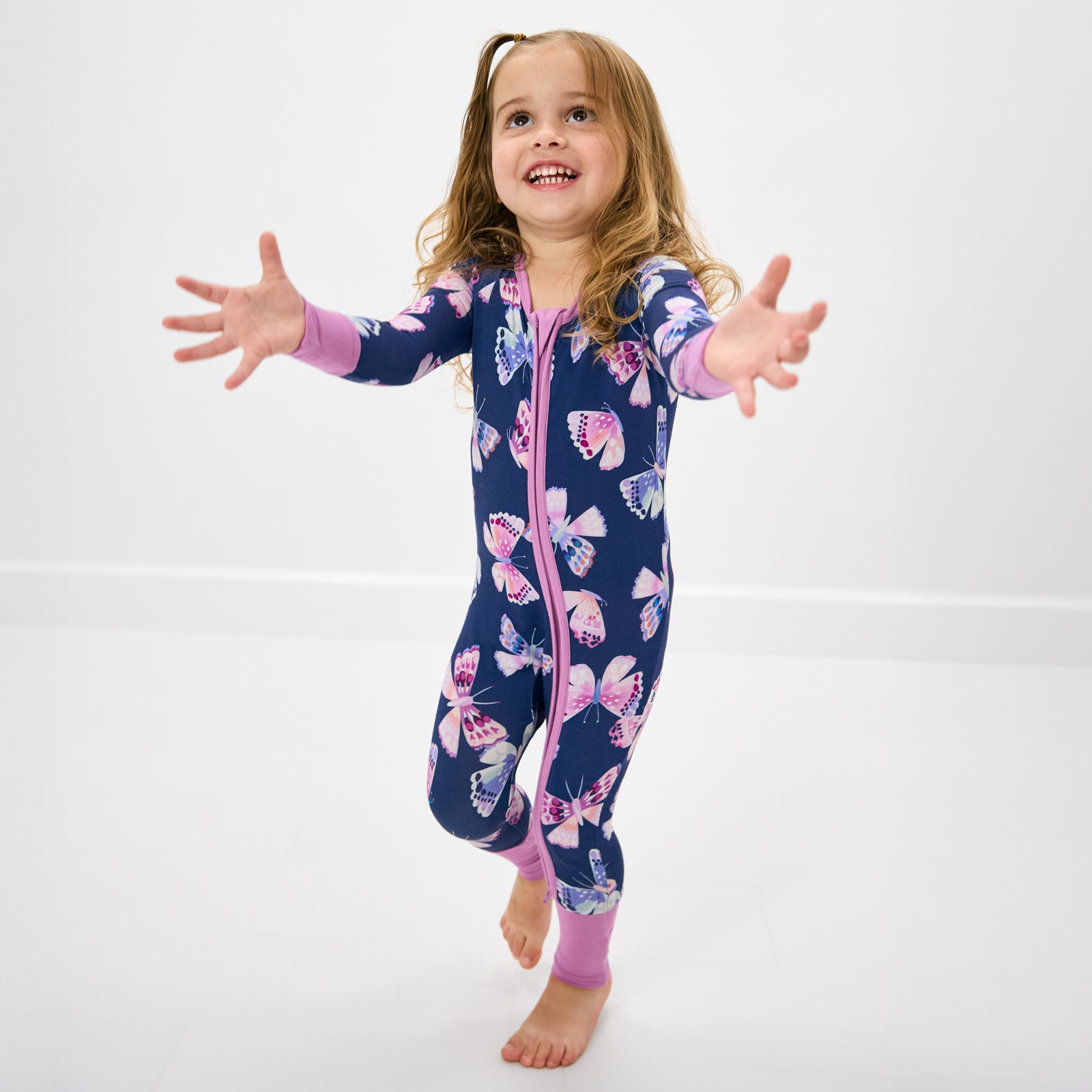 Alternate of walking toddler wearing the Royal Butterflies Bamboo Zippy