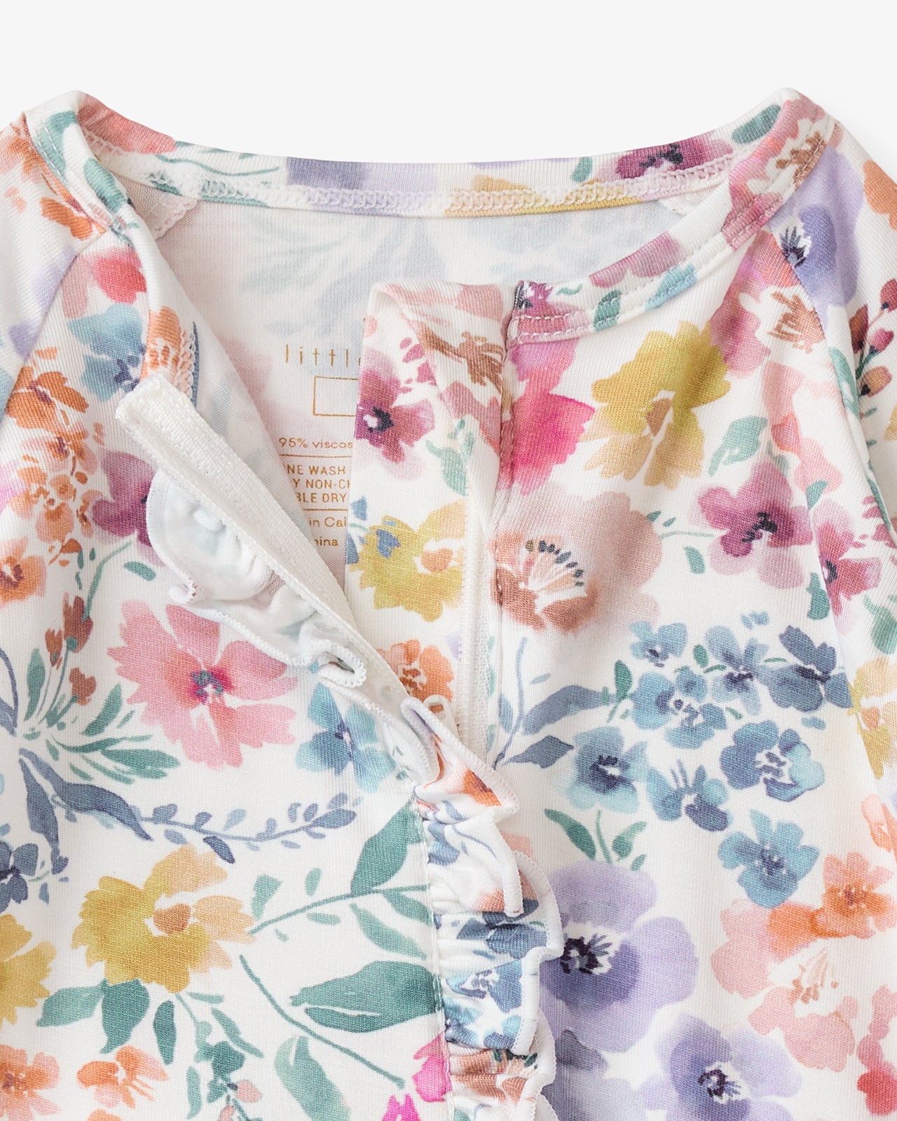 Close up of the neck opening on the Tiny Blooms Ruffle Zippy