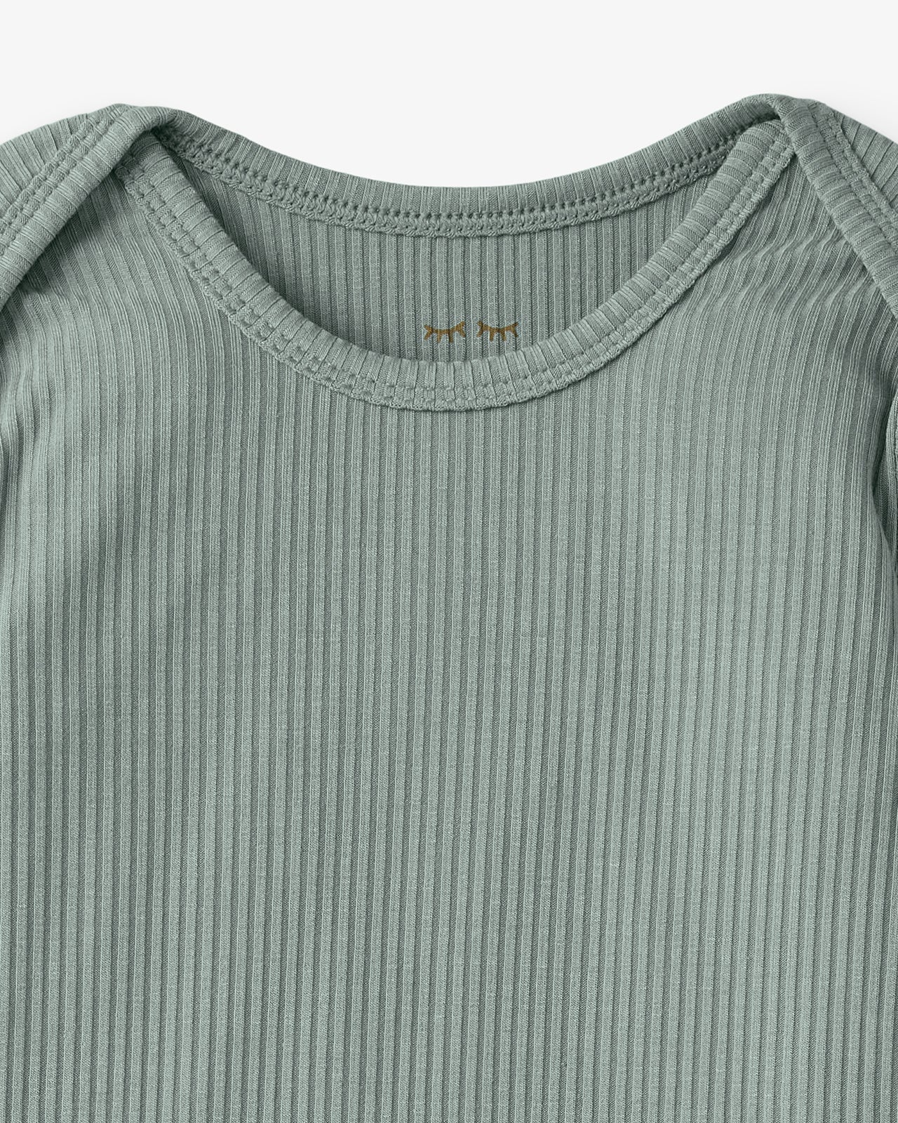 Close up flat lay of the neck opening on the Willow Ribbed Infant Gown