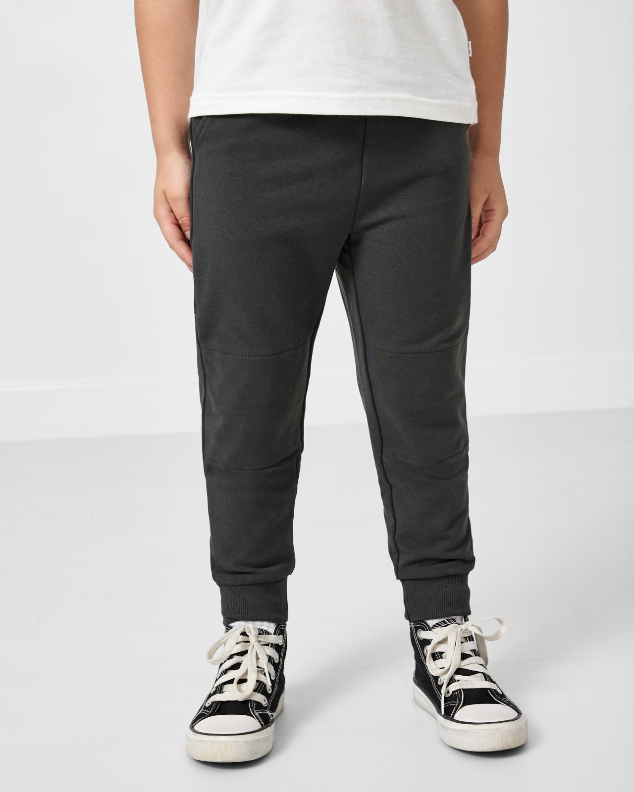 Boy wearing the Shadow Gray Jogger and a white tshirt