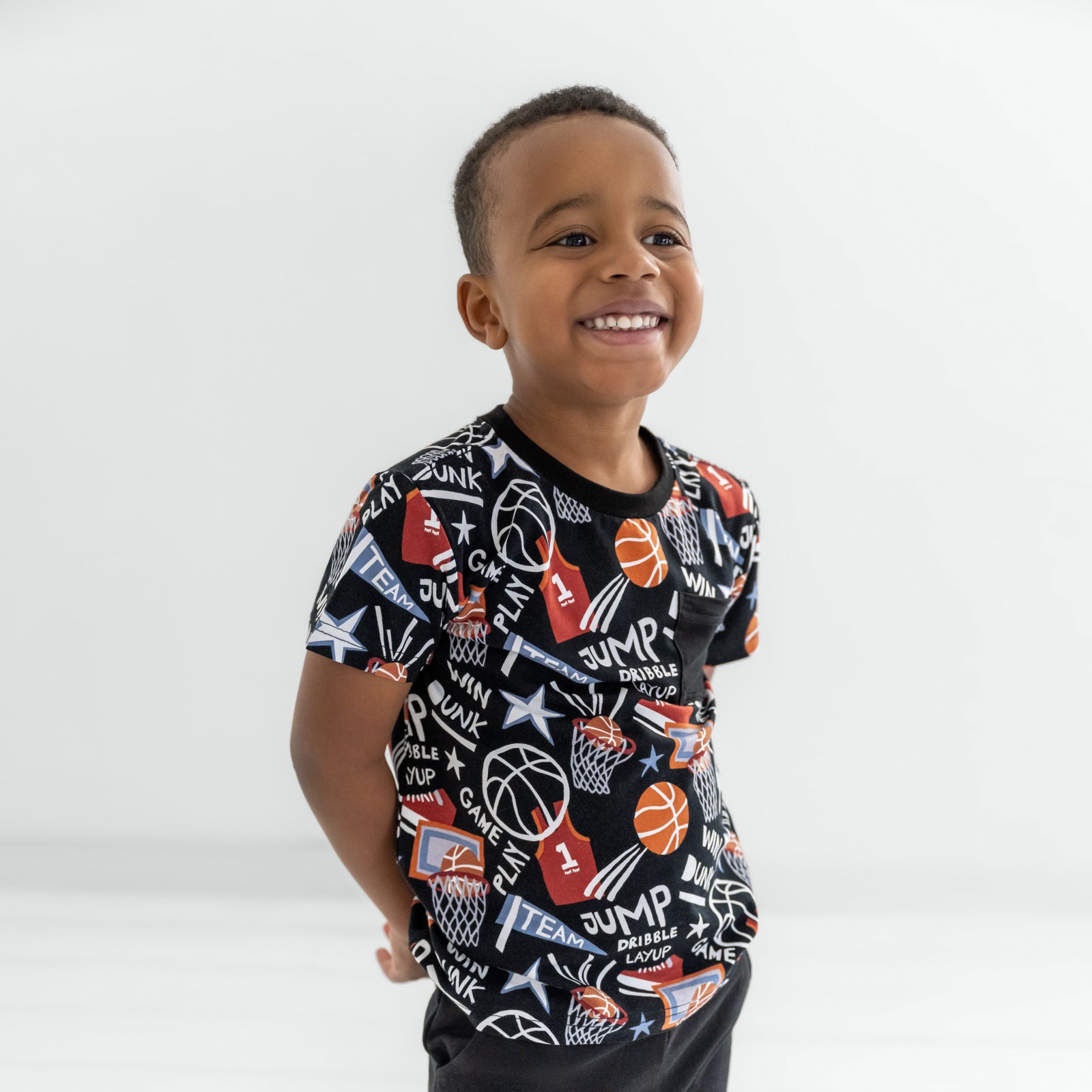Child wearing the Black Slam Dunk Pocket tee