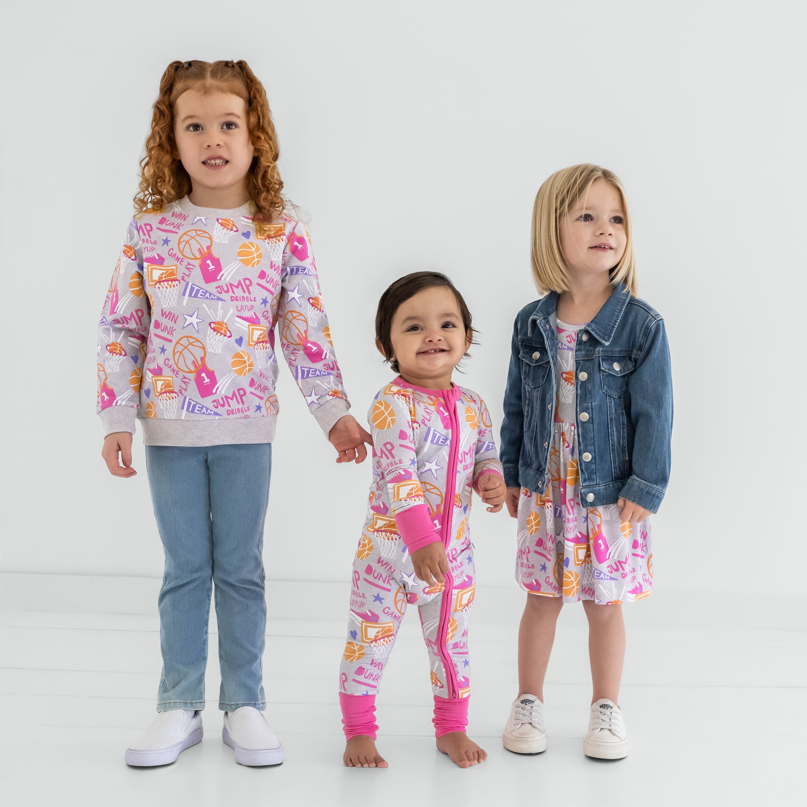 Three children wearing matching Pink Slam Dunk styles