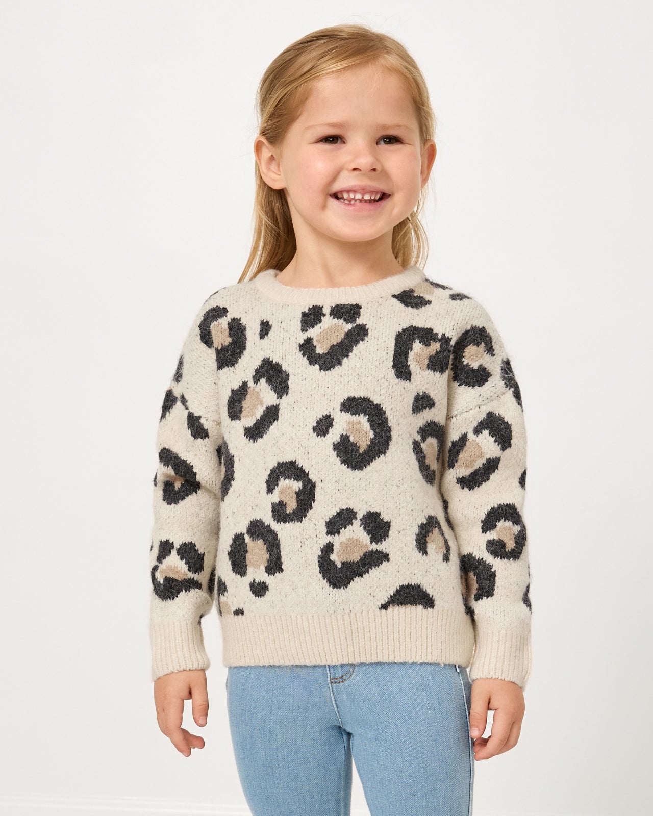Girl wearing the Snowy Leopard Drop Shoulder Sweater