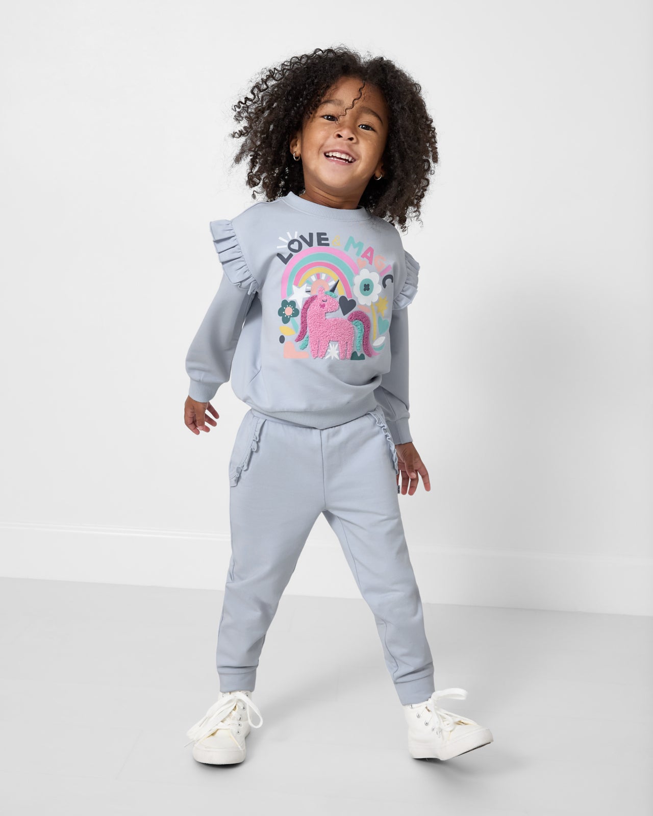 Alternate girl wearing the Unicorn Ruffle Crewneck and Sweatpants