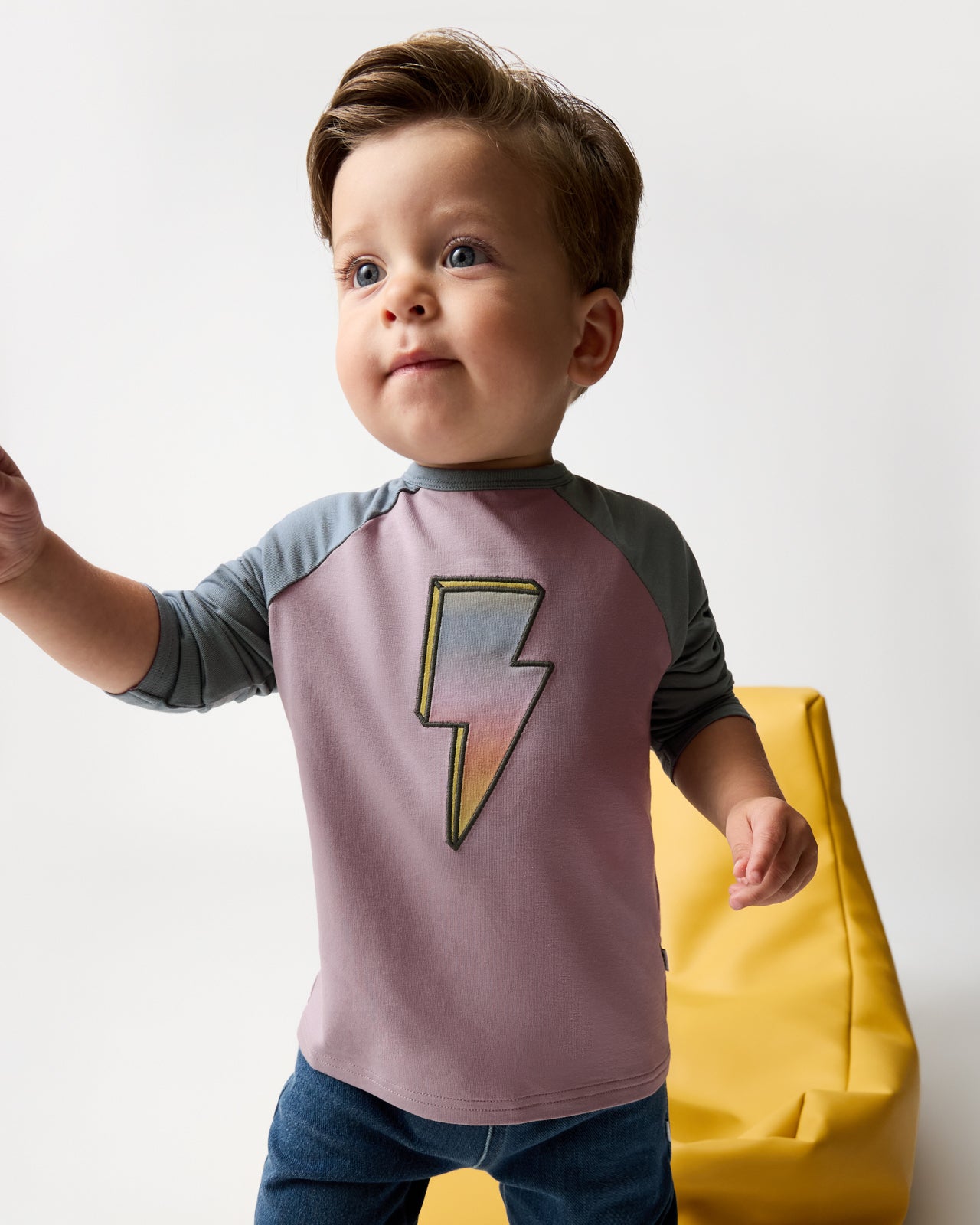 Boy wearing the Bolt Raglan Tee